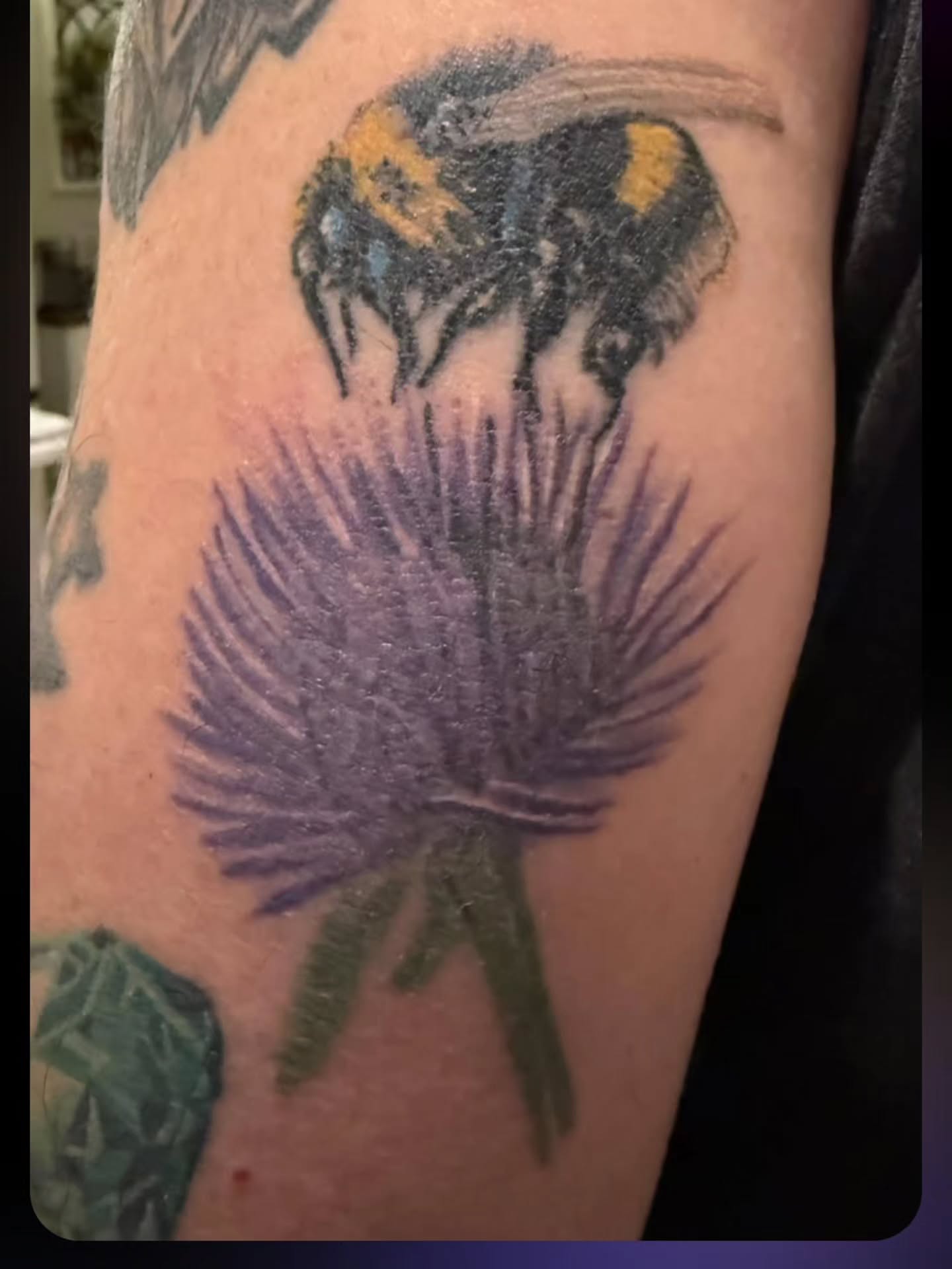 Bee and flower realism tattoo on the forearm by Karen Cain