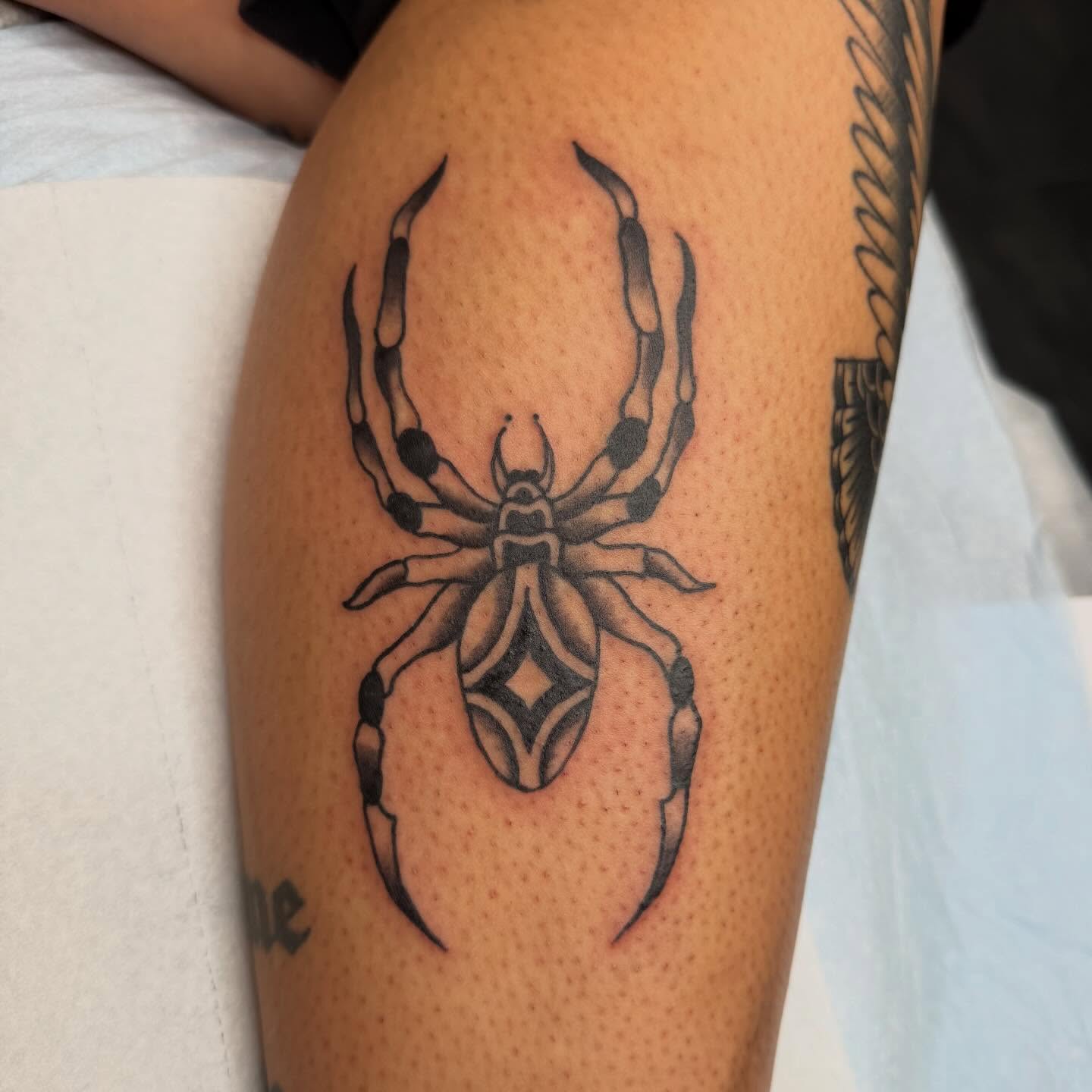 Spider geometric tattoo on the thigh by savannah