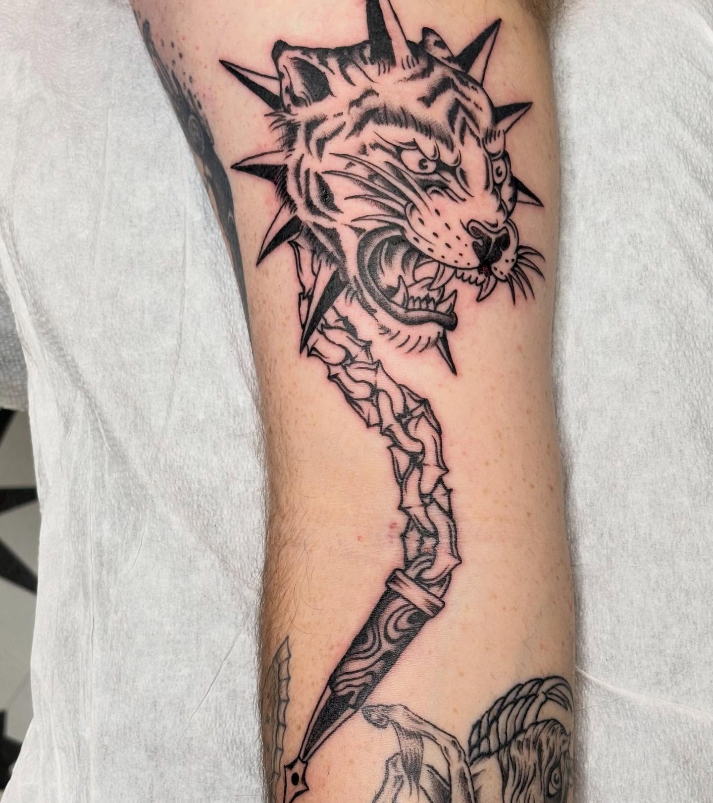 Tiger head with dagger realism tattoo on the forearm by ☻︎ Cyd Precious ☹︎