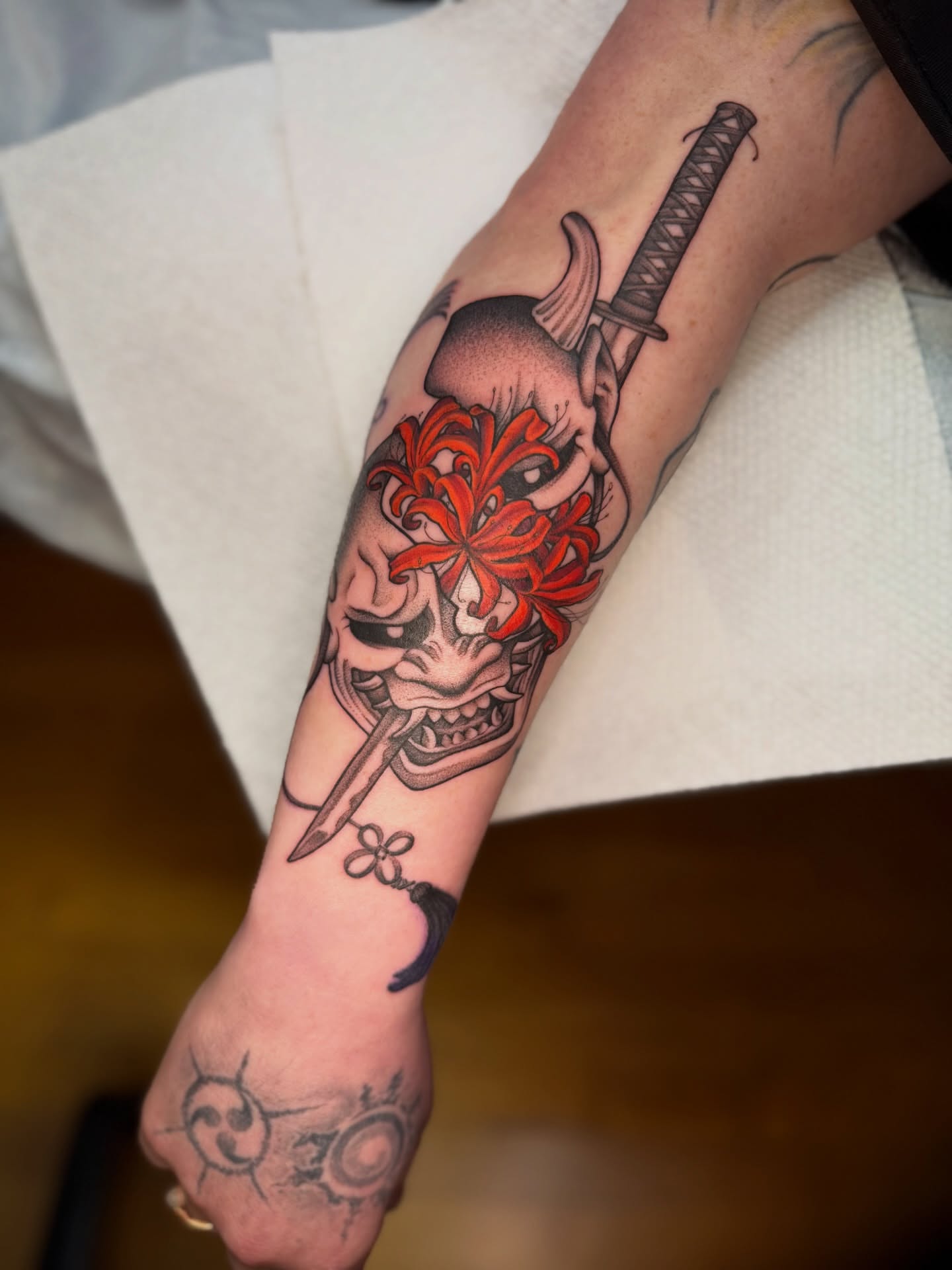 Mask with flower and sword japanese irezumi tattoo on the forearm by ๐ฎ Kira Yamanashi