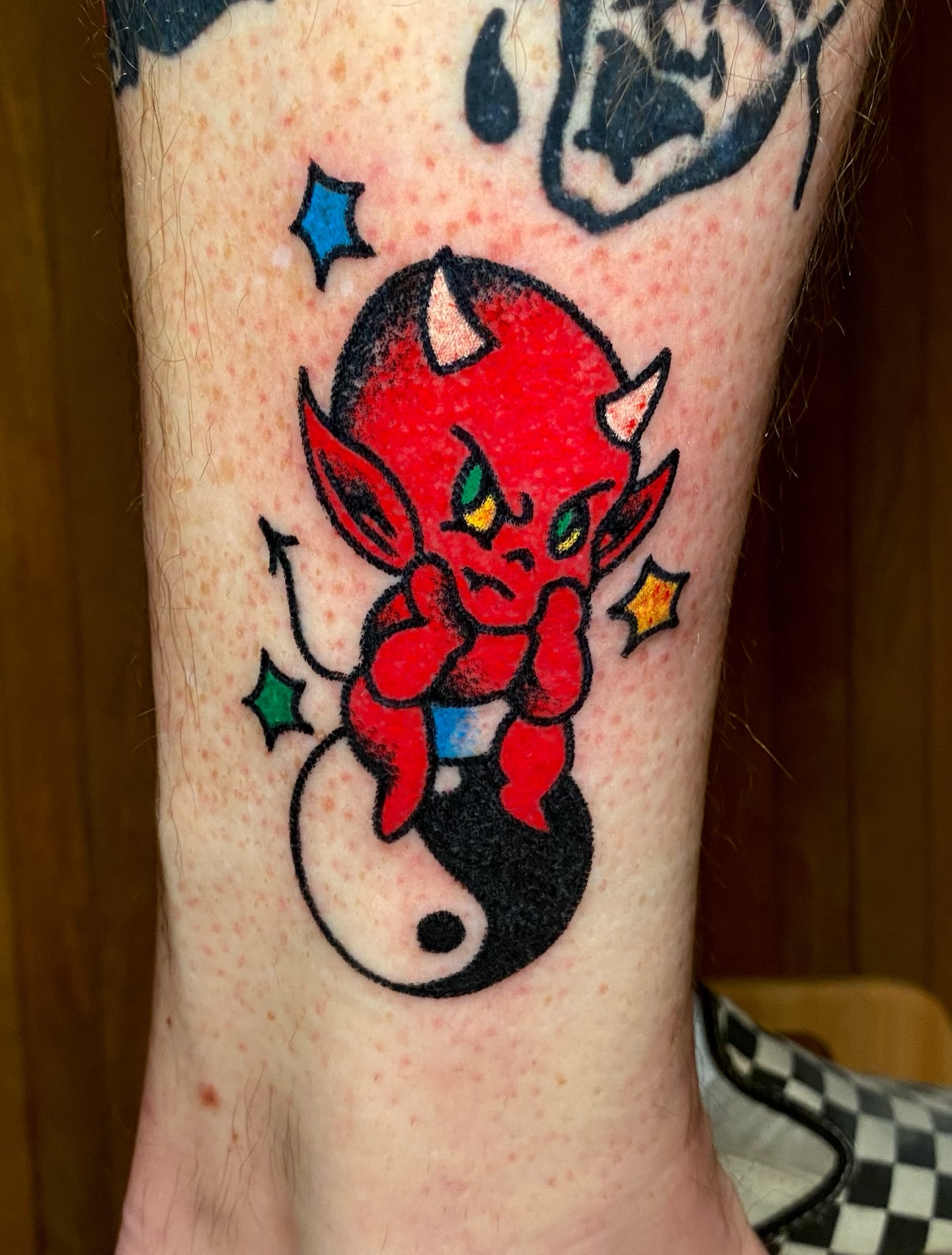 Red devil new school tattoo on the forearm by Daniel Diego