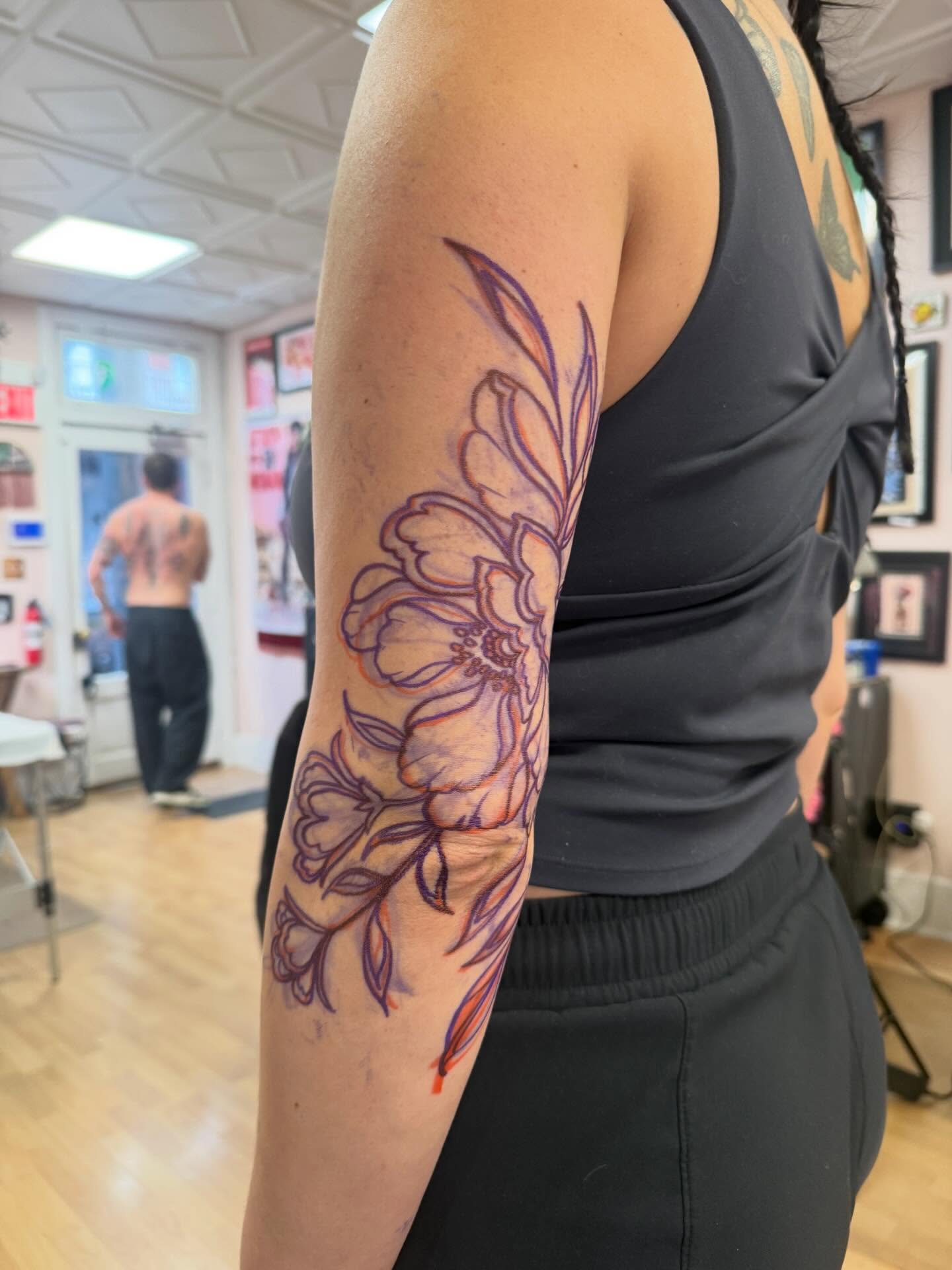 Floral design fine line tattoo on the forearm by Samantha Compasso Ford