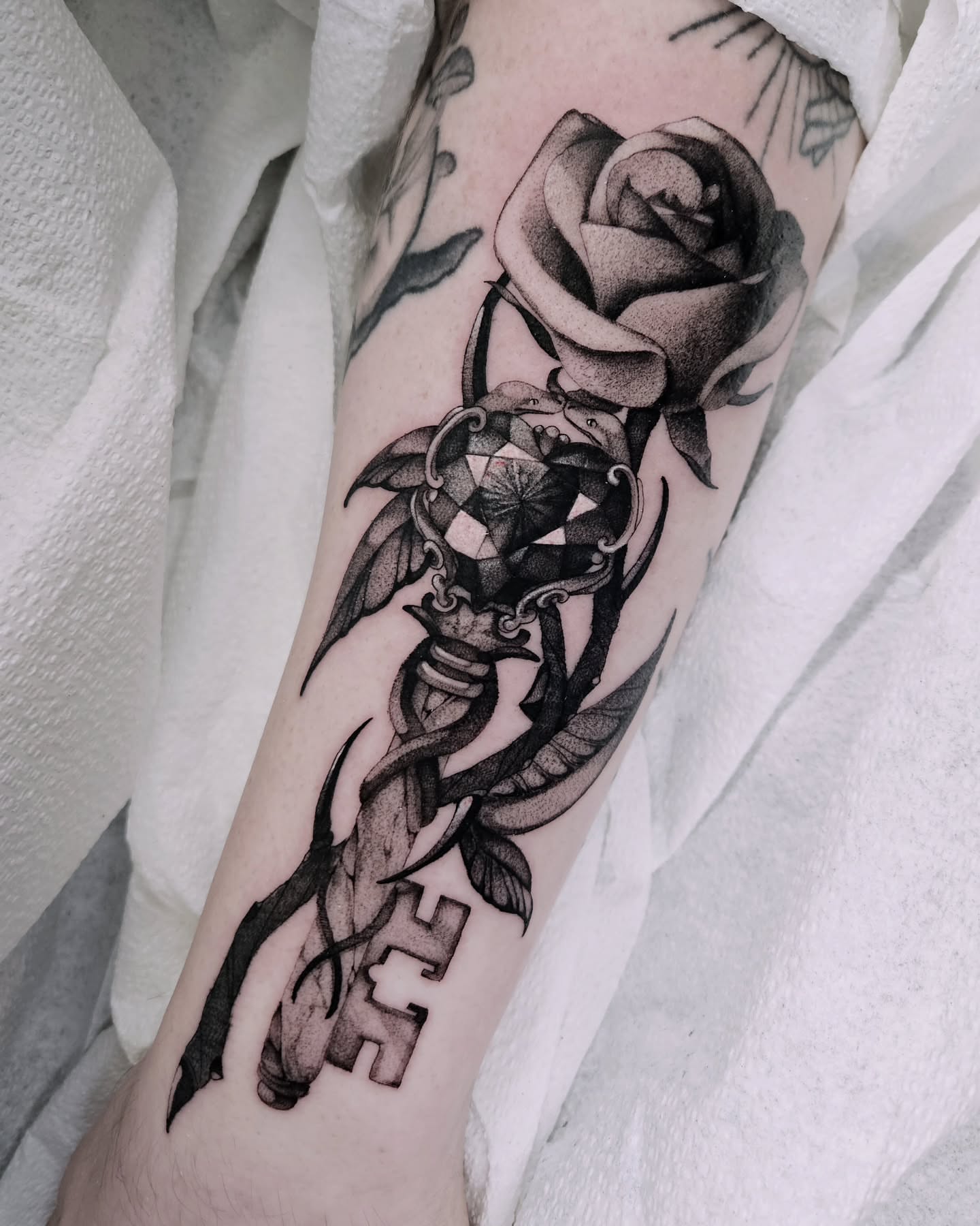 Tattoo by @fermented_ink — black_and_grey, realism