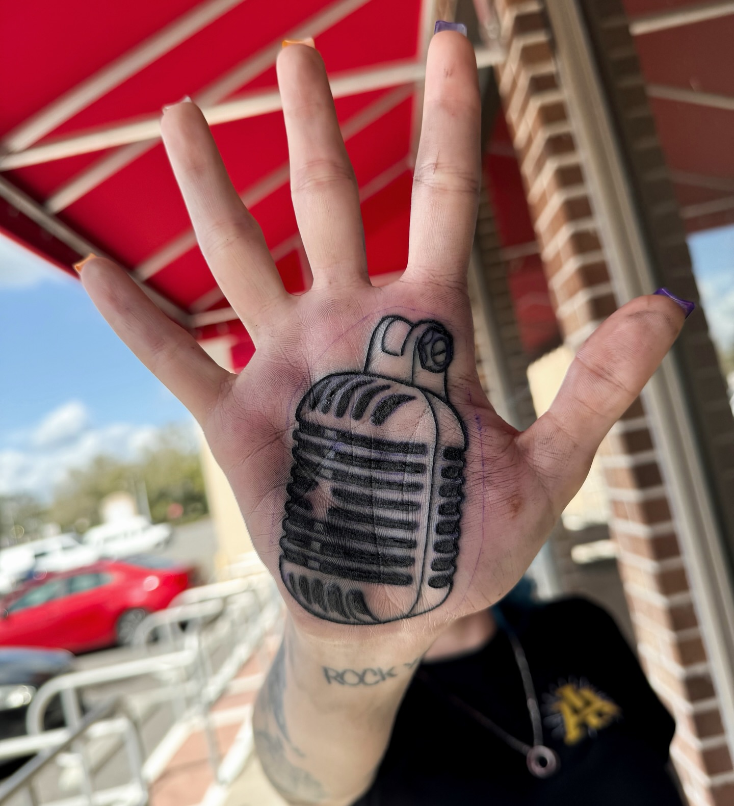 Microphone black and grey tattoo on the hand by Hades cabrera, Richmond, Virginia