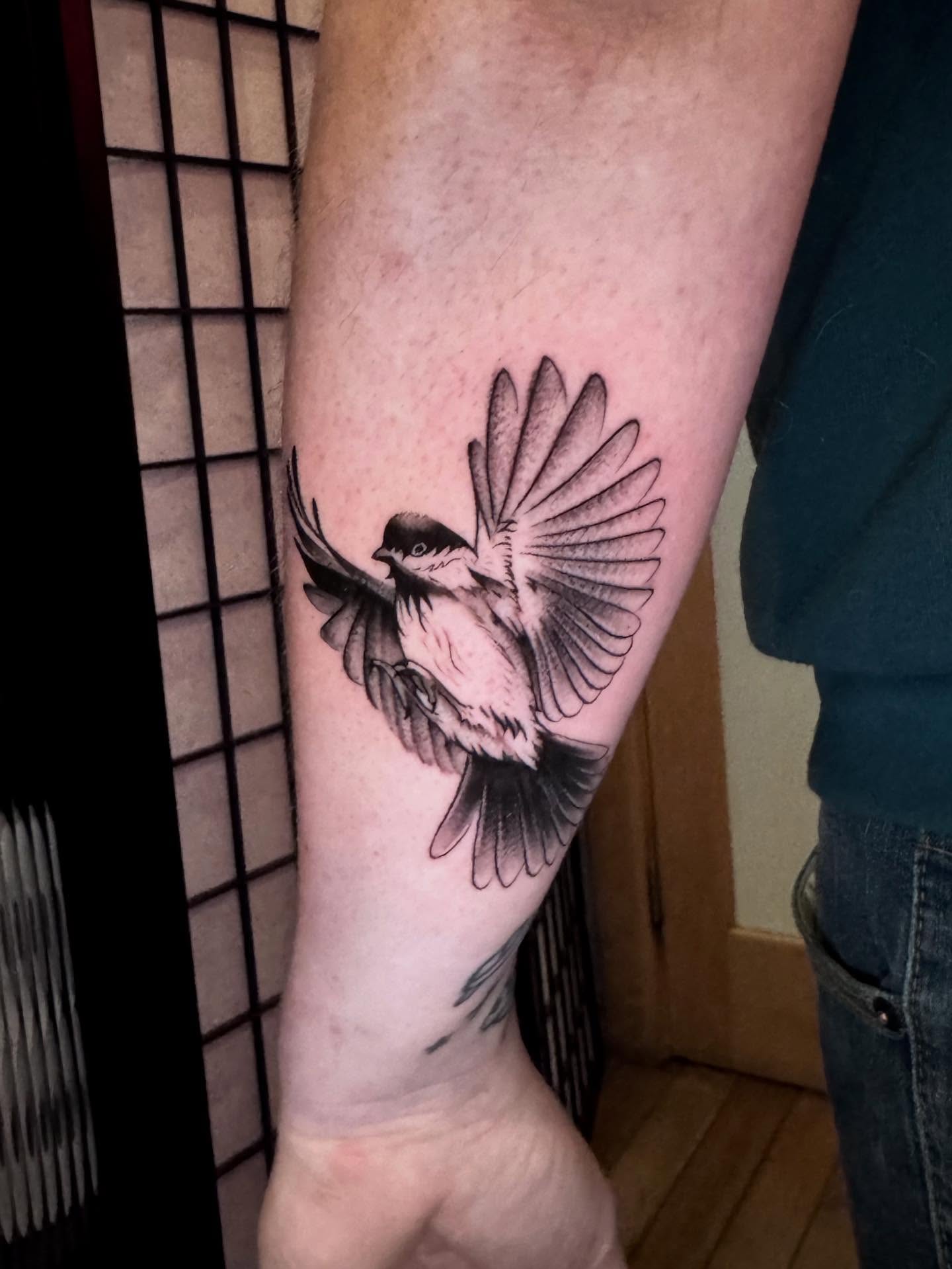 Bird black and grey tattoo on the forearm by Morgan Peeples
