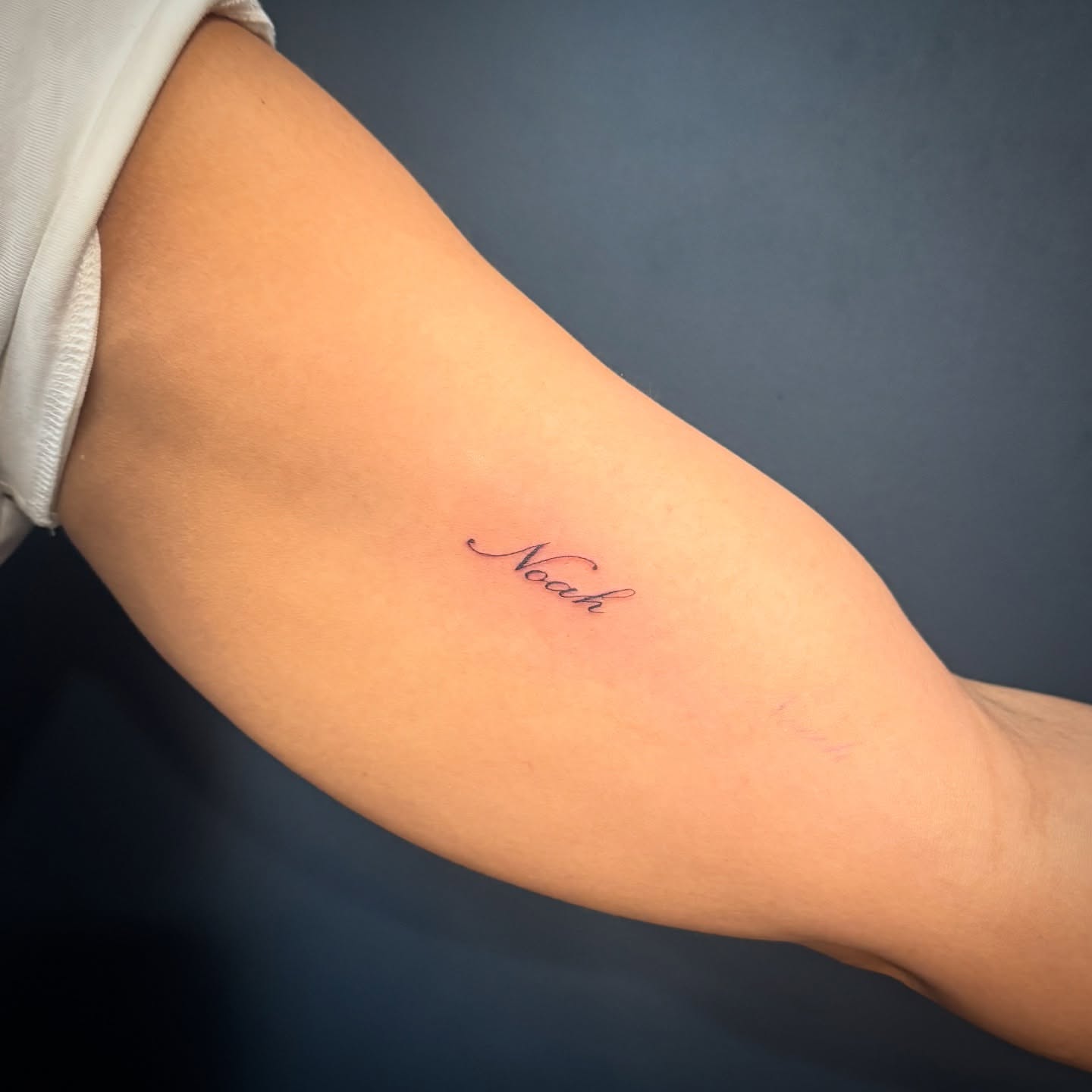 Noah lettering script tattoo on the forearm by Madison Davenport, Saddle Brook, New Jersey