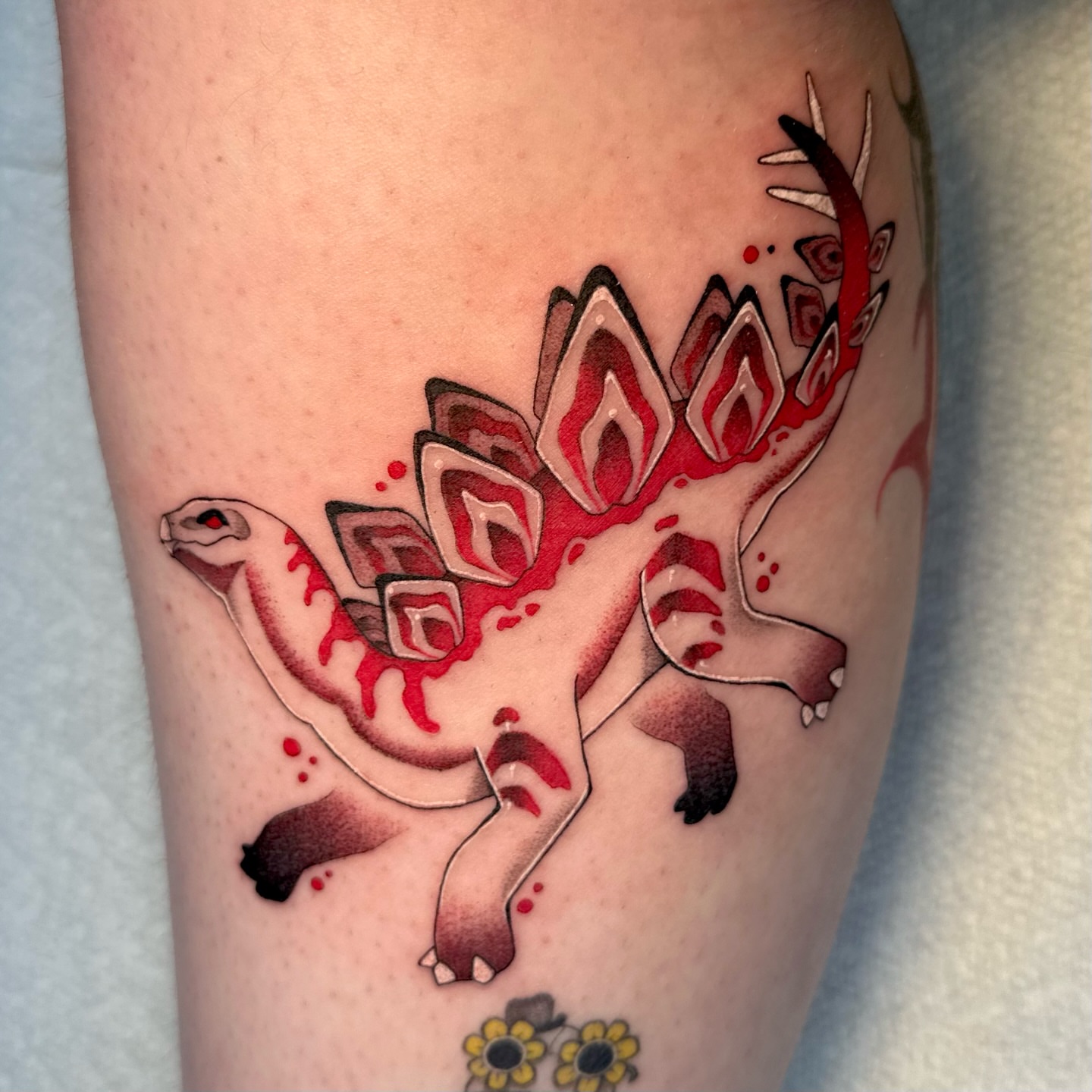 Dinosaur geometric tattoo on the forearm by Ghost