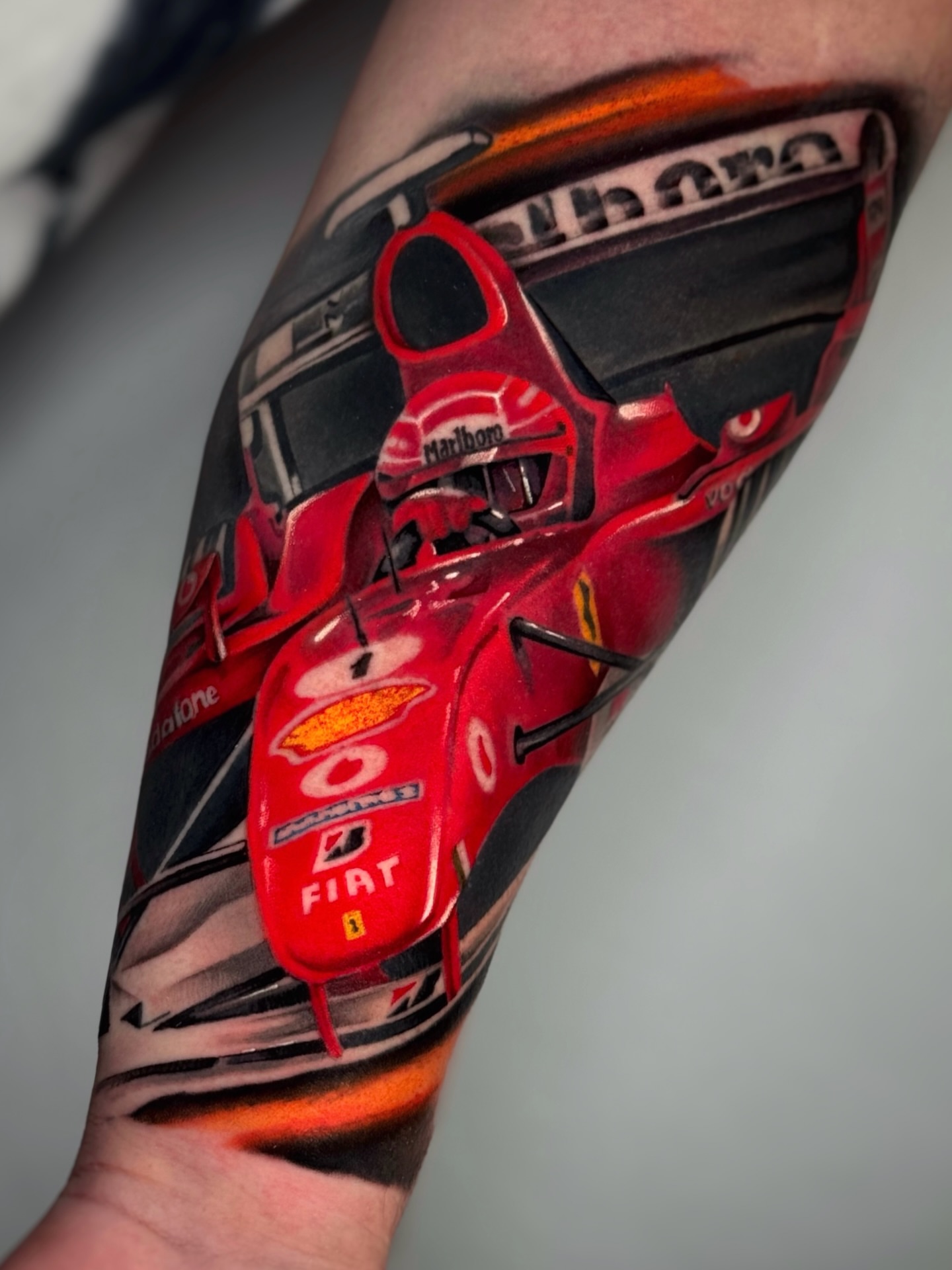 Formula one car realism tattoo on the forearm by Aitor Arie, Roseville, California