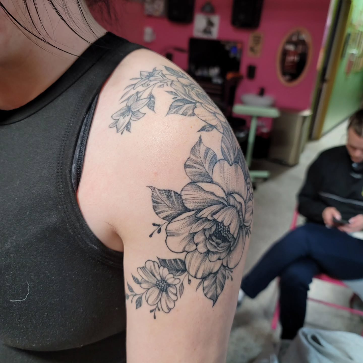 Floral arrangement black and grey tattoo on the shoulder by Mary Lefeau