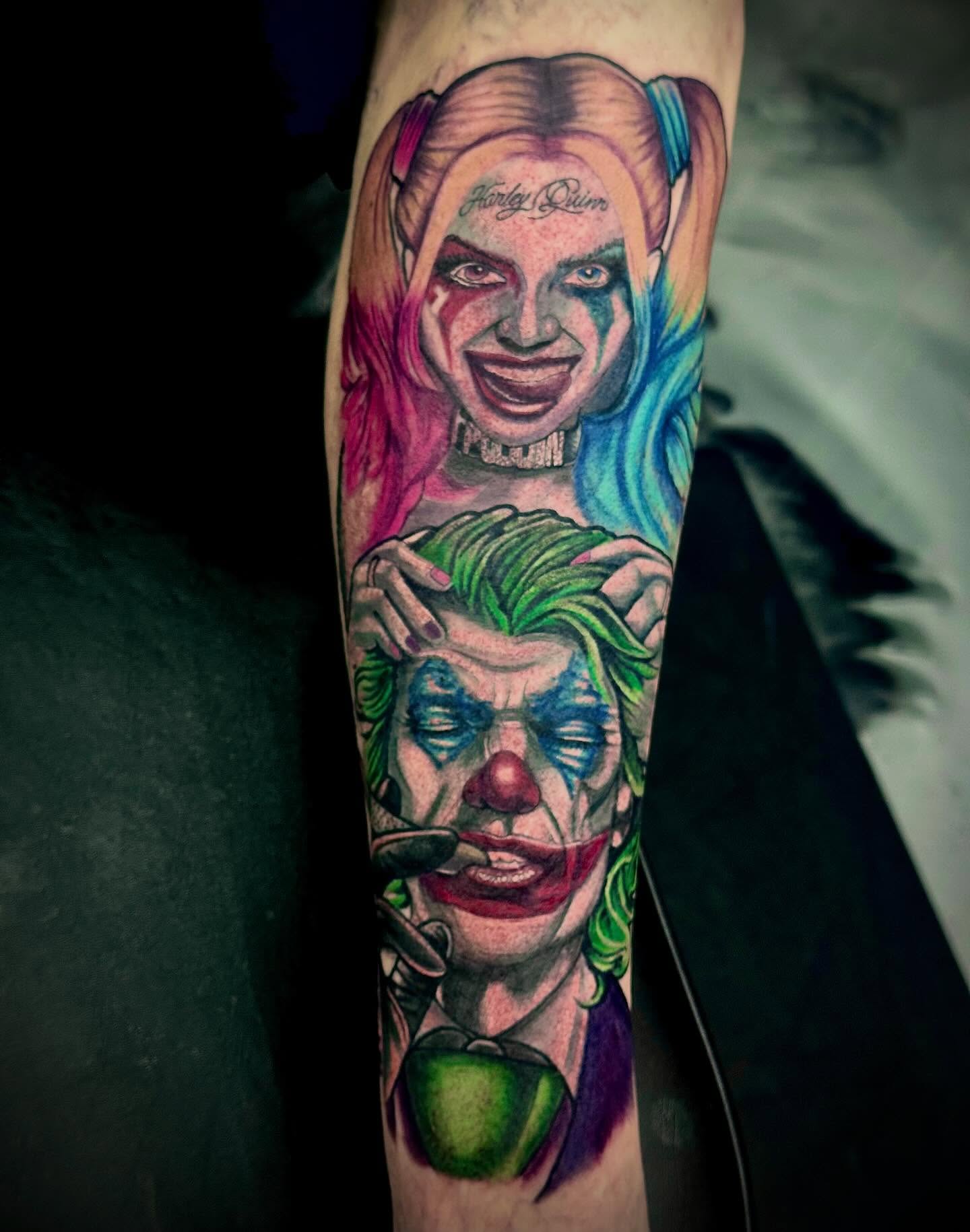 Harley Quinn and Joker realism tattoo on the forearm by Labbé