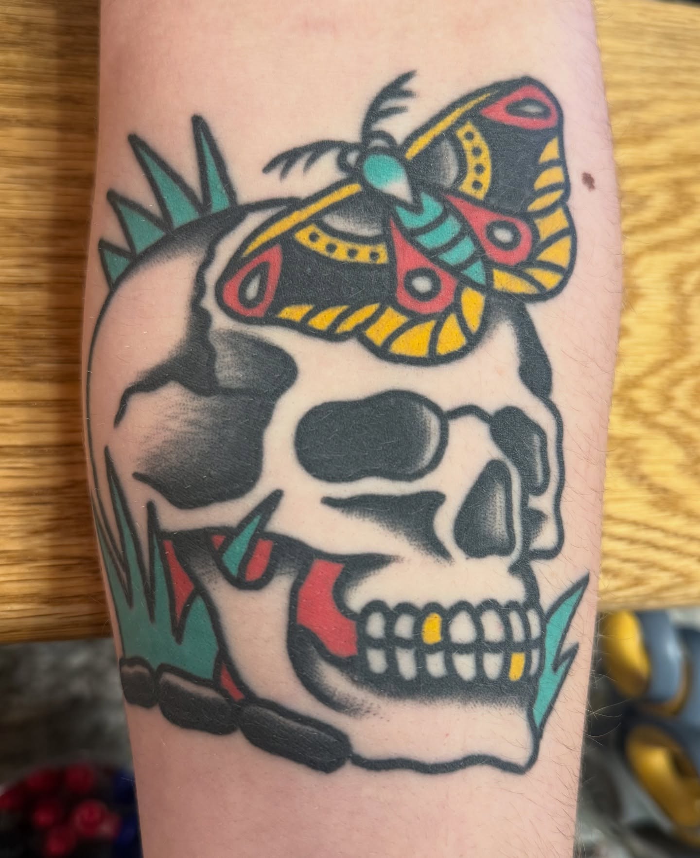 Skull with butterfly American traditional tattoo on the forearm by ๐ฎ๐๐๐๐ ๐ญ๐๐๐๐๐
