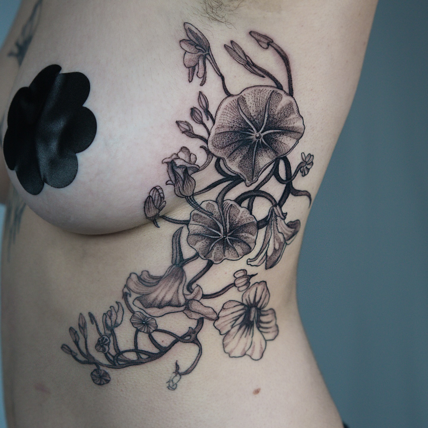 Flowers dotwork tattoo on the ribs by H I R A  L U P E - tattoo artist, Oakland, California
