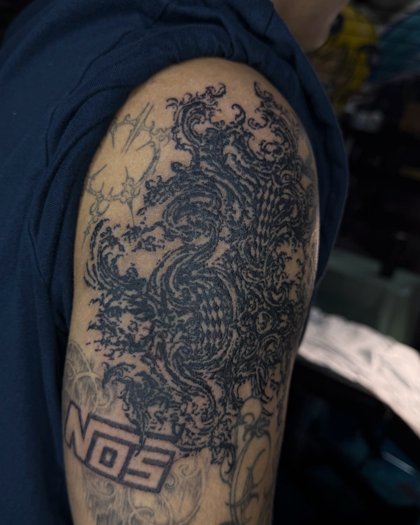 Dragon black and grey tattoo on the shoulder by Penelope