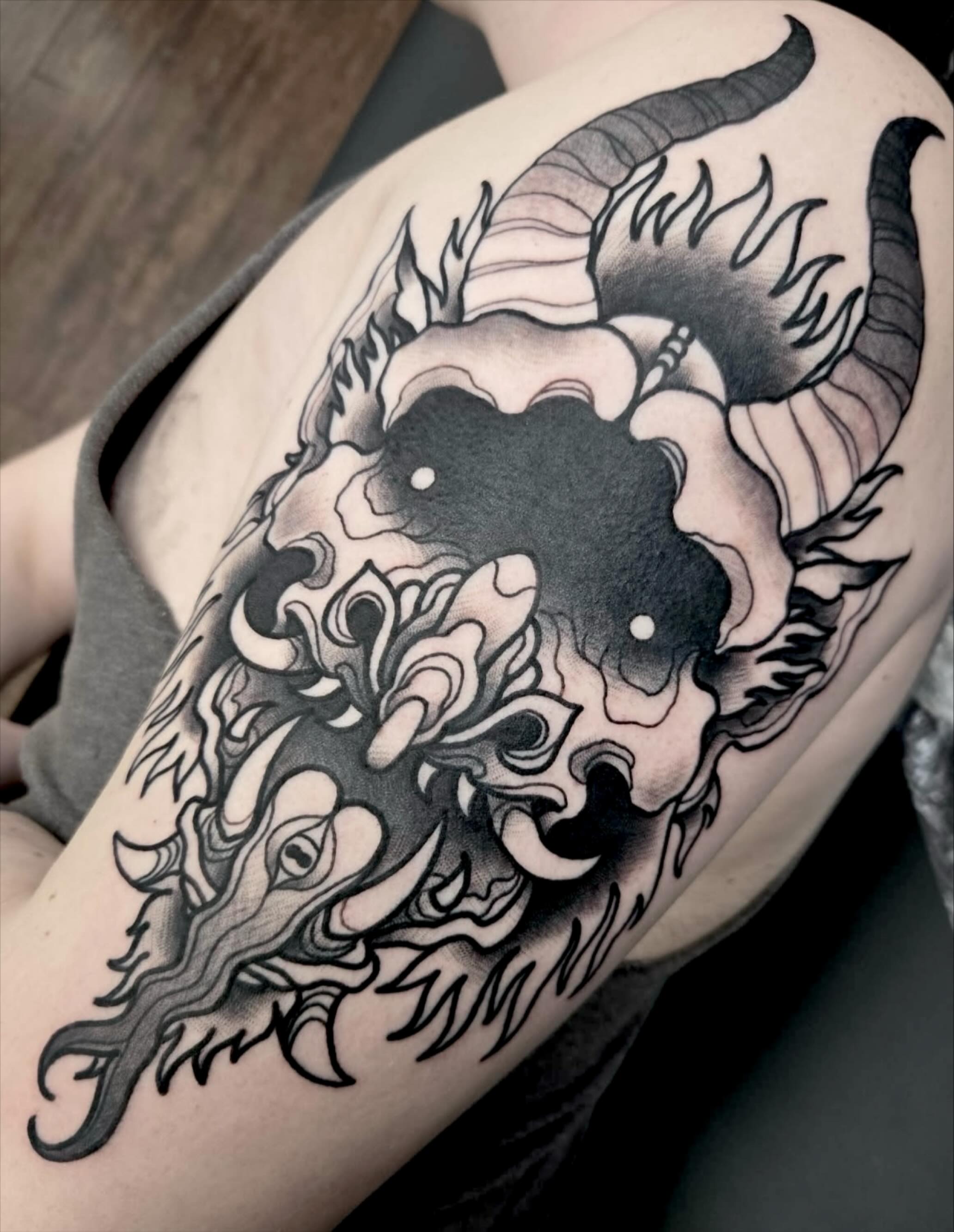 Ram skull black and grey tattoo on the shoulder by ๐