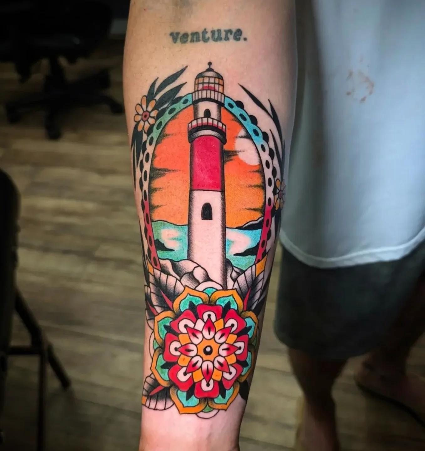 Lighthouse American traditional tattoo on the forearm by joseph palladino