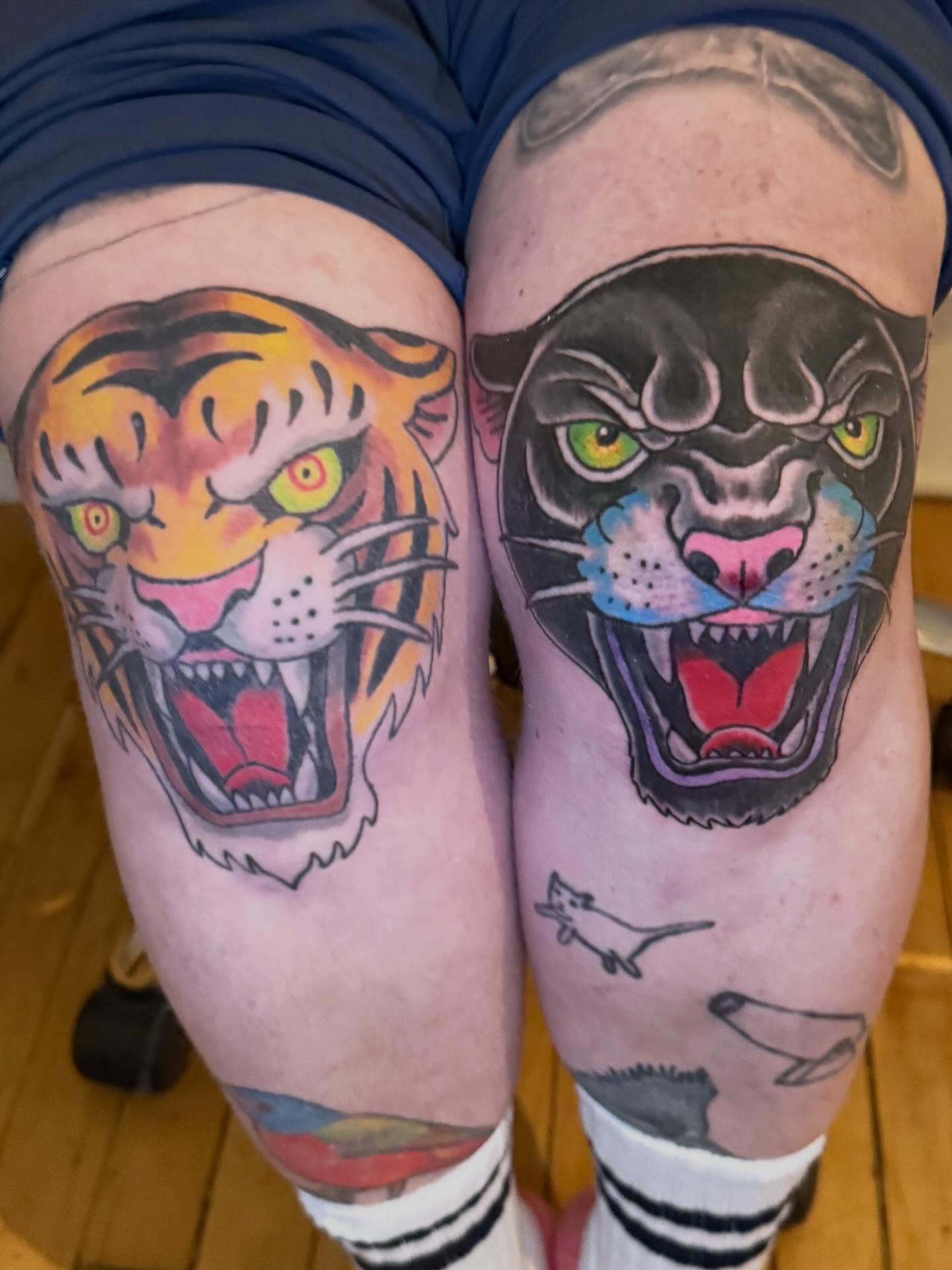 Tiger and panther American traditional tattoo on the thigh by Patrick Cornolo