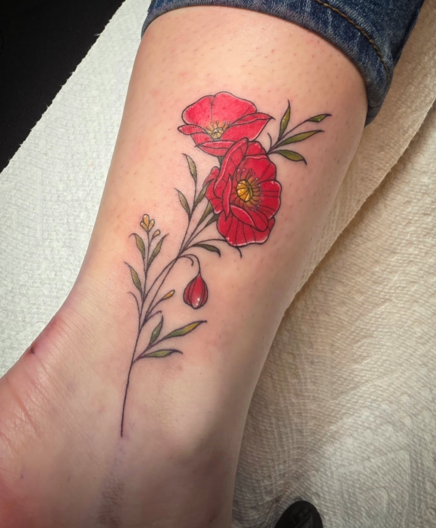 Red poppies realism tattoo on the forearm by Cassieal Welch