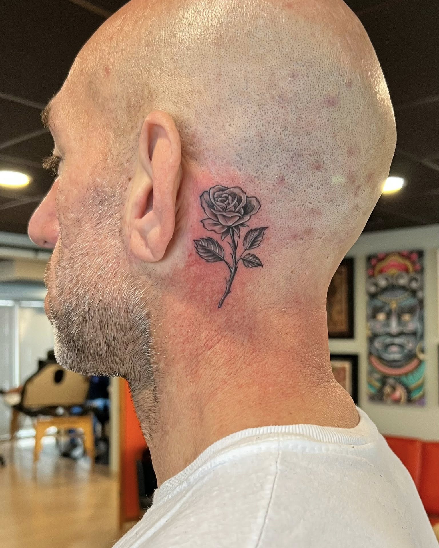 Rose black and grey tattoo on the neck by Jessica Kloos