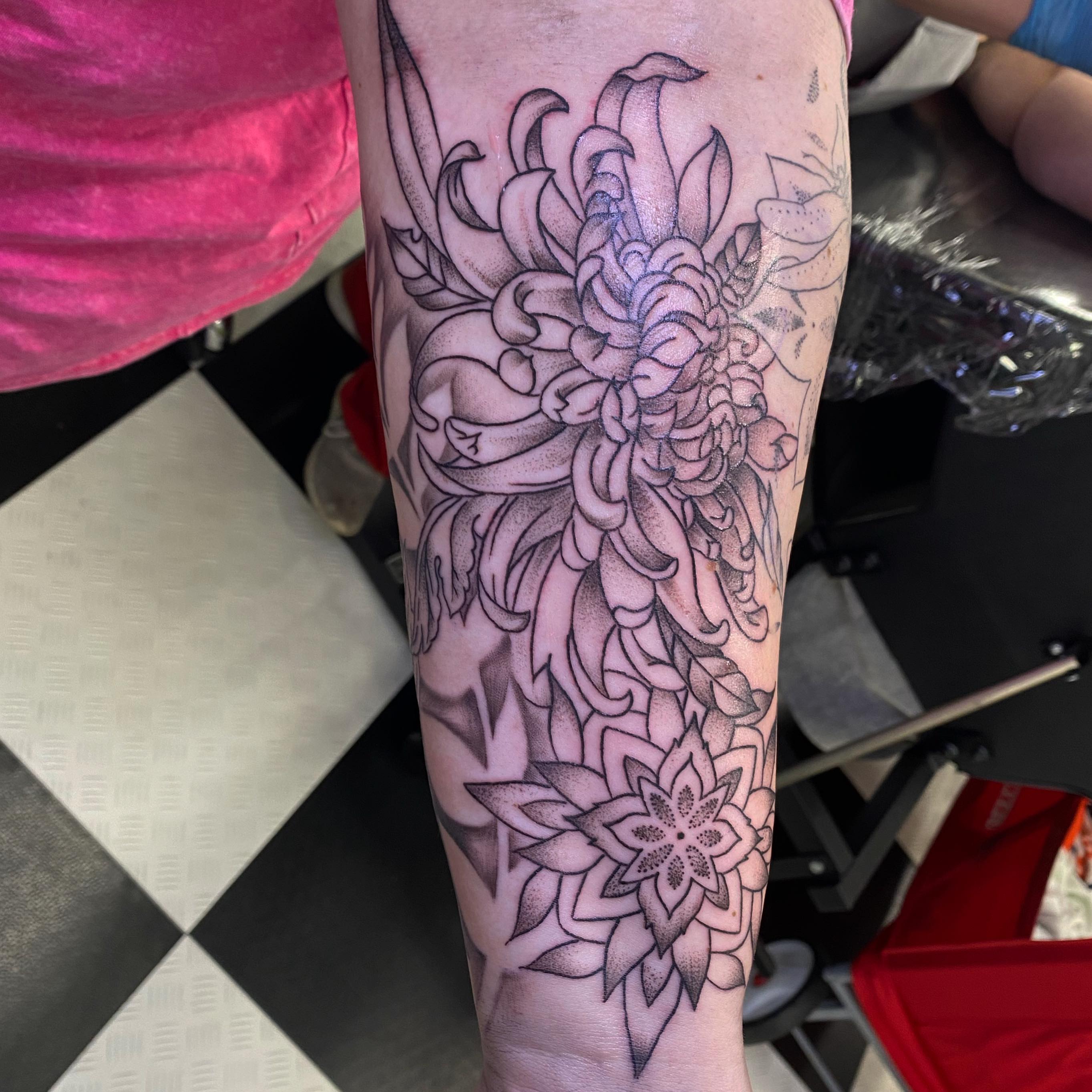 Chrysanthemum dotwork tattoo on the forearm by Spencer Jones Tattoos
