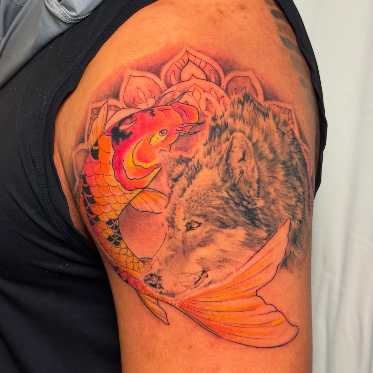 Wolf and koi fish realism tattoo on the shoulder by James Nelson