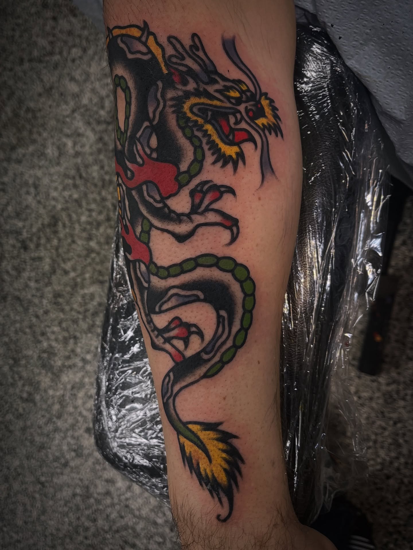 Dragon American traditional tattoo on the forearm by Deya Aven, Nashville, Tennessee