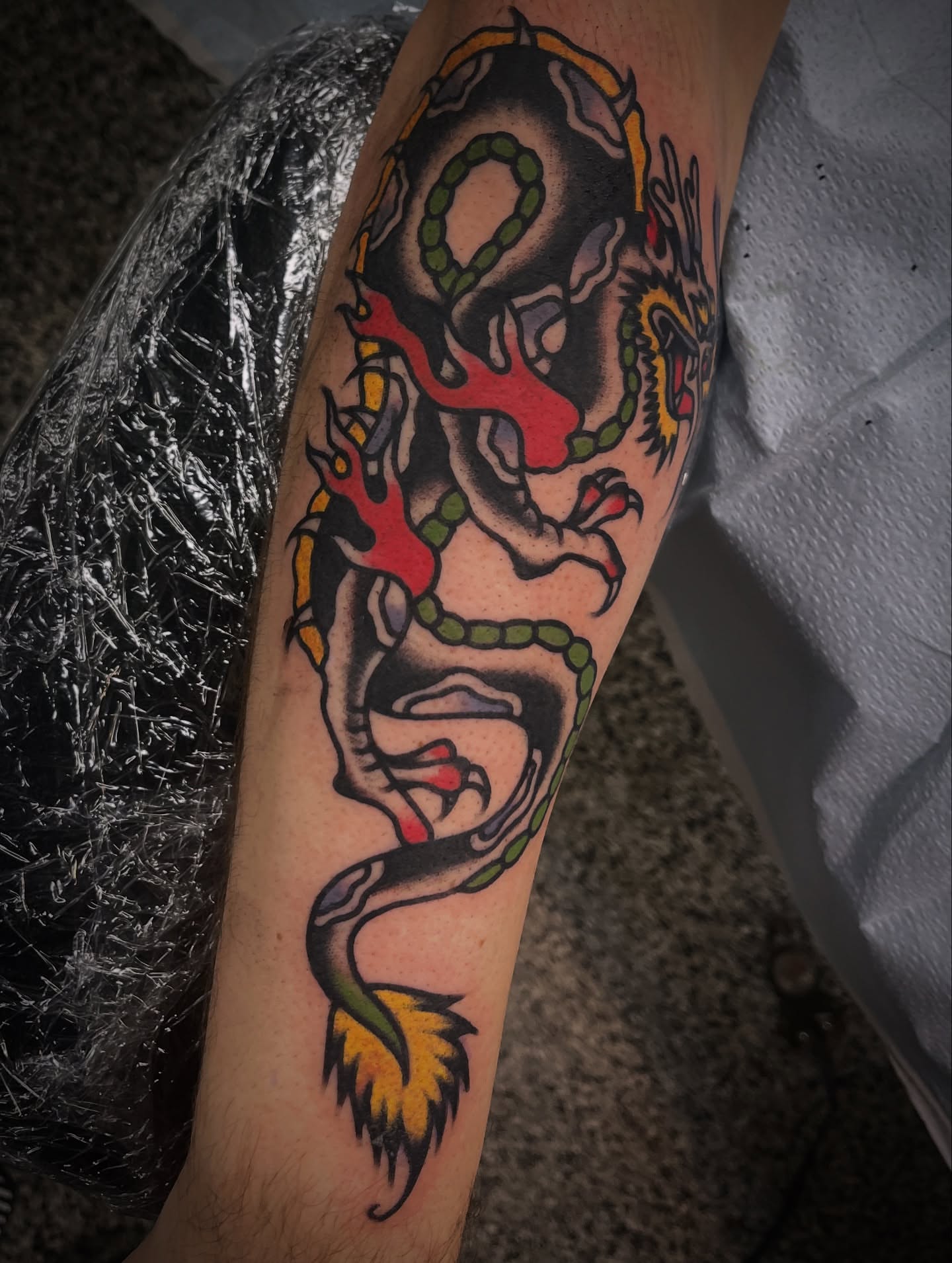 Dragon American traditional tattoo on the forearm by Deya Aven, Nashville, Tennessee