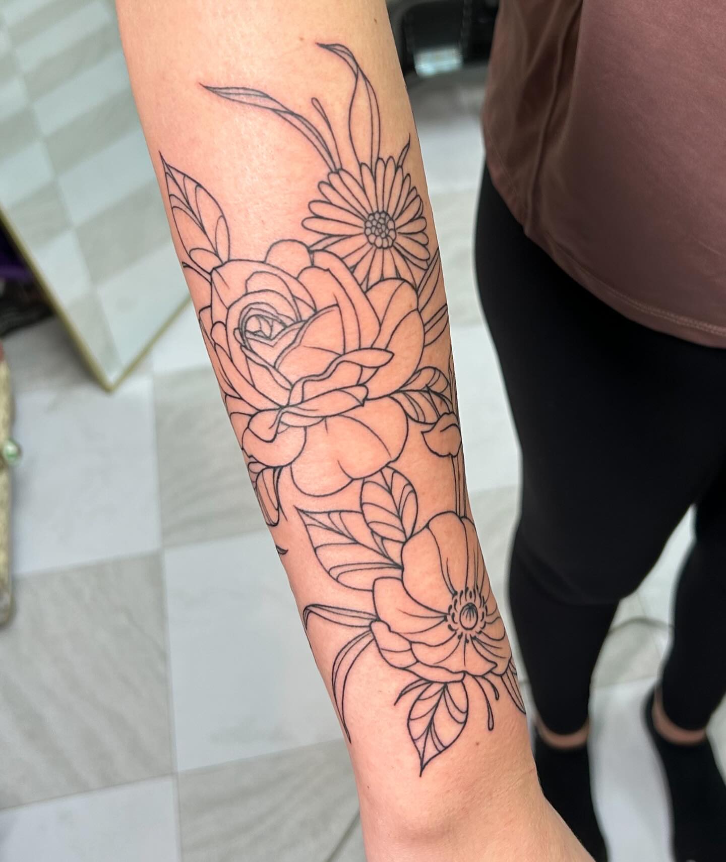 Floral bouquet black and grey tattoo on the forearm by kuna ink