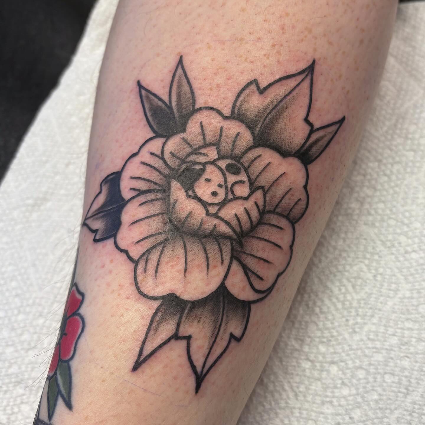 Flower with hidden figure American traditional tattoo on the forearm by ♡ Demi ♡