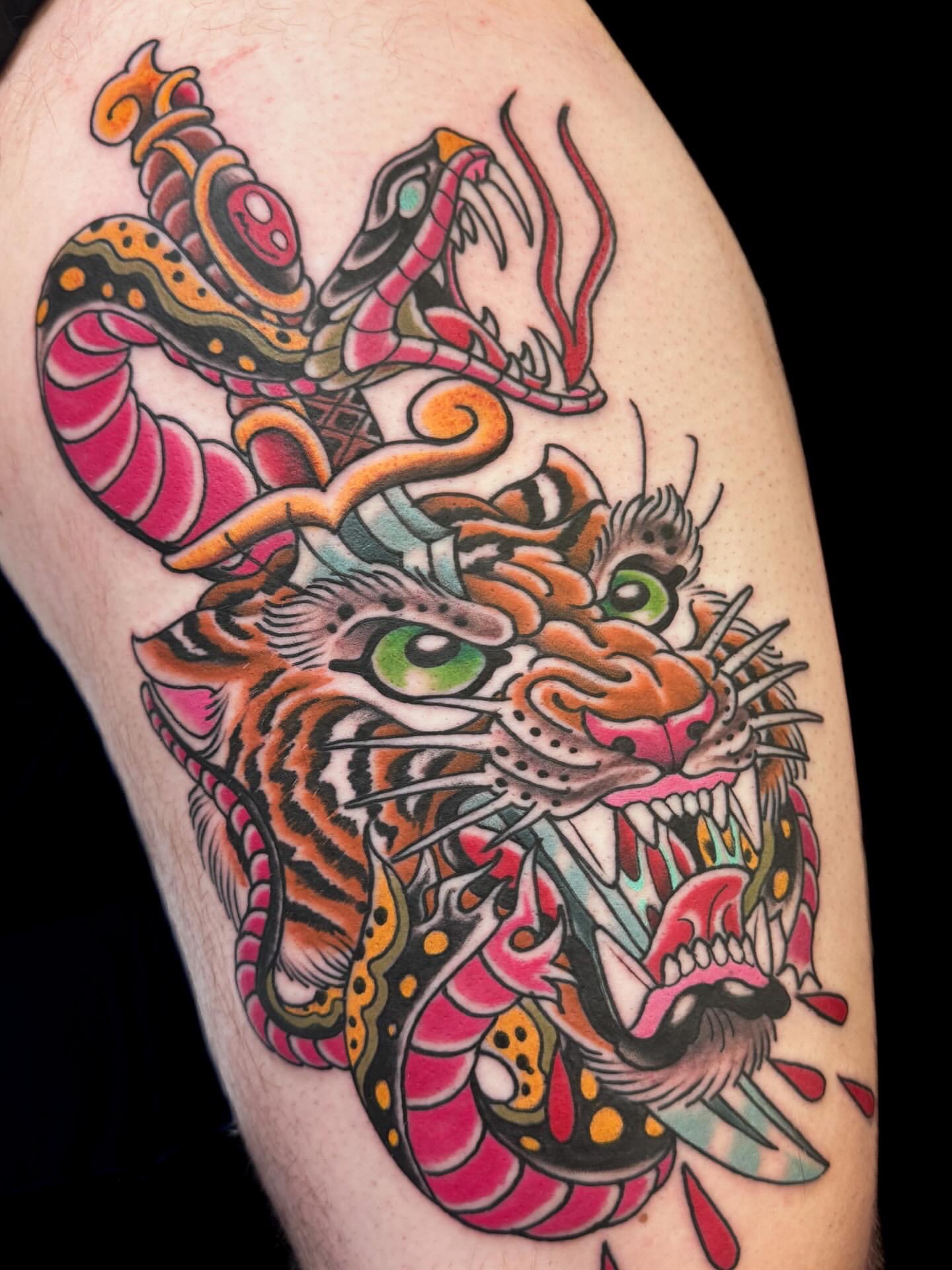 Tiger and snake American traditional tattoo on the thigh by Bob Lackner