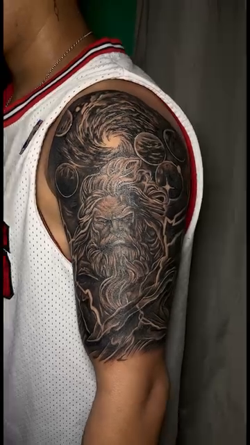Bearded man with cosmic background Japanese tattoo on the upper arm by Gerd thINK_TATTOO