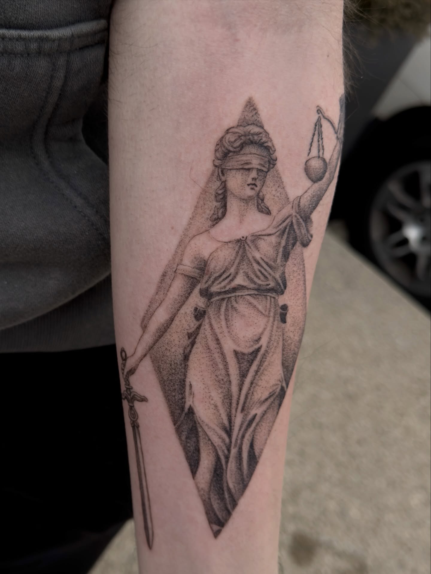 Justice statue realism tattoo on the forearm by Kevin Rotramel, Dayton, Ohio