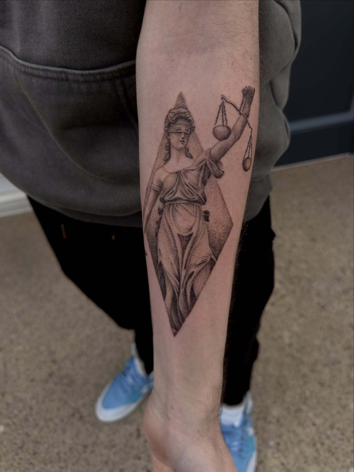Lady Justice black and grey tattoo on the forearm by Kevin Rotramel, Dayton, Ohio