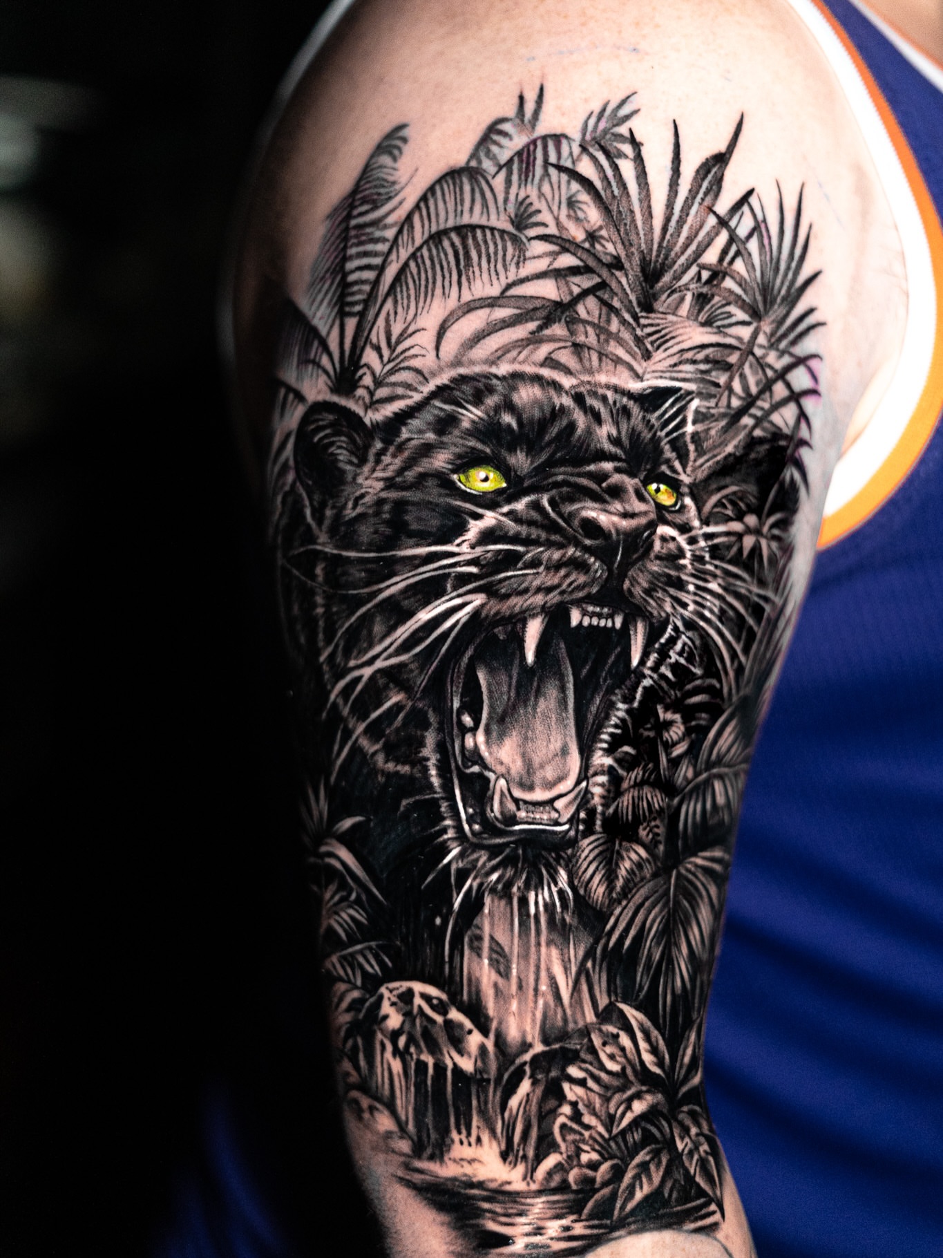 Black panther in jungle realism tattoo on the forearm by James Jurado
