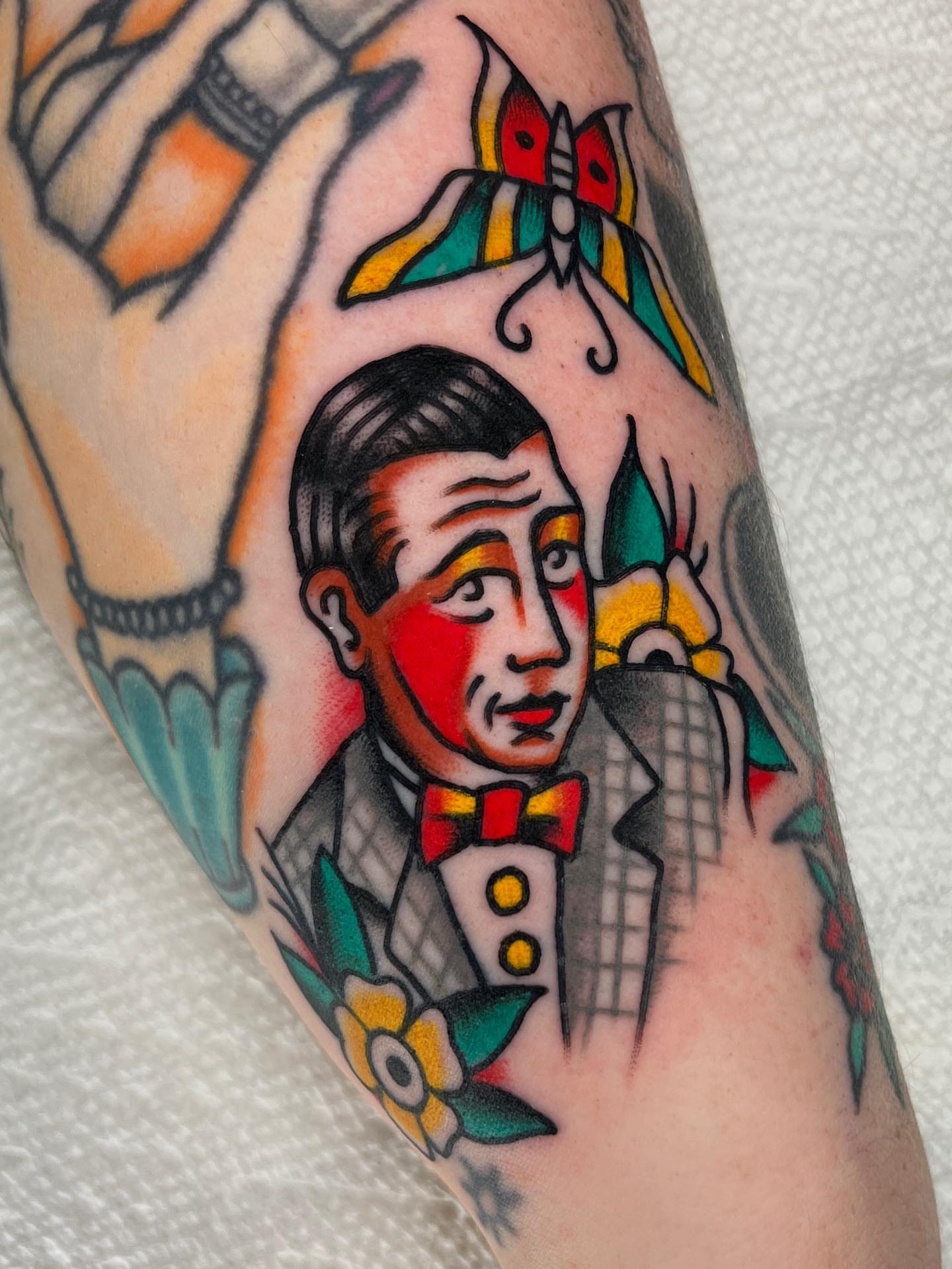 Clown American traditional tattoo on the forearm by Charlie Ostrom, Durham, North Carolina