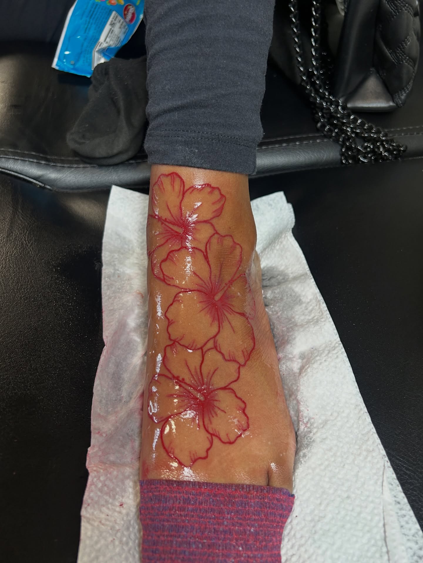 Flowers new school tattoo on the foot by nylachanel