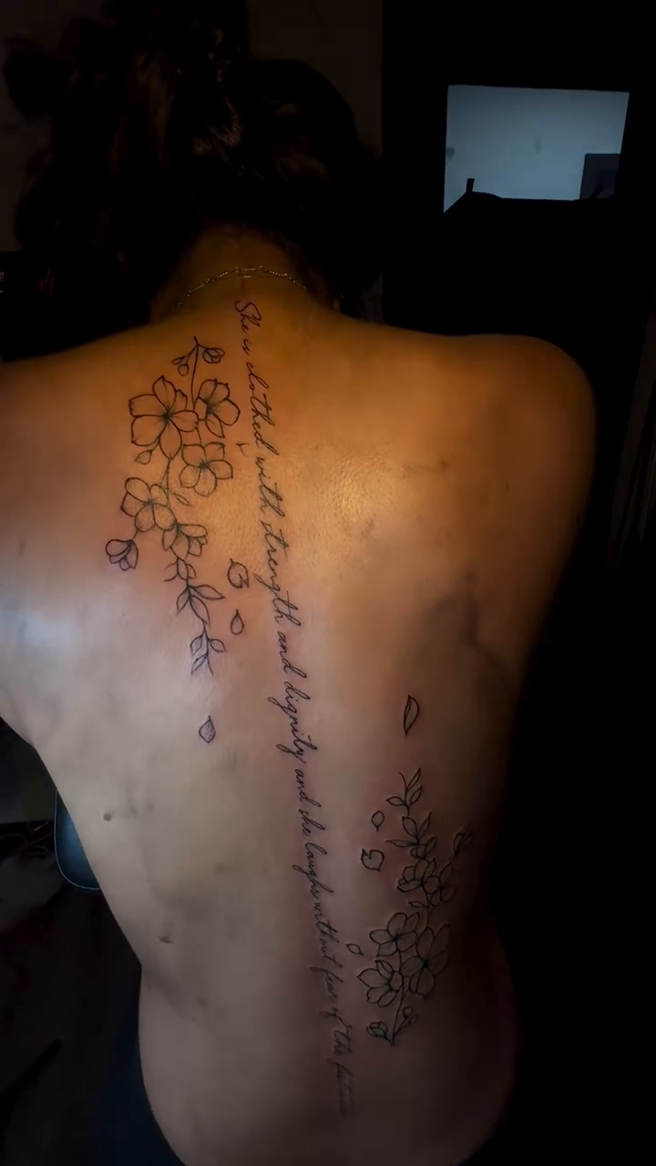 Script and floral elements watercolor tattoo on the back by Barbie Mari ๐
โญ๏ธ
