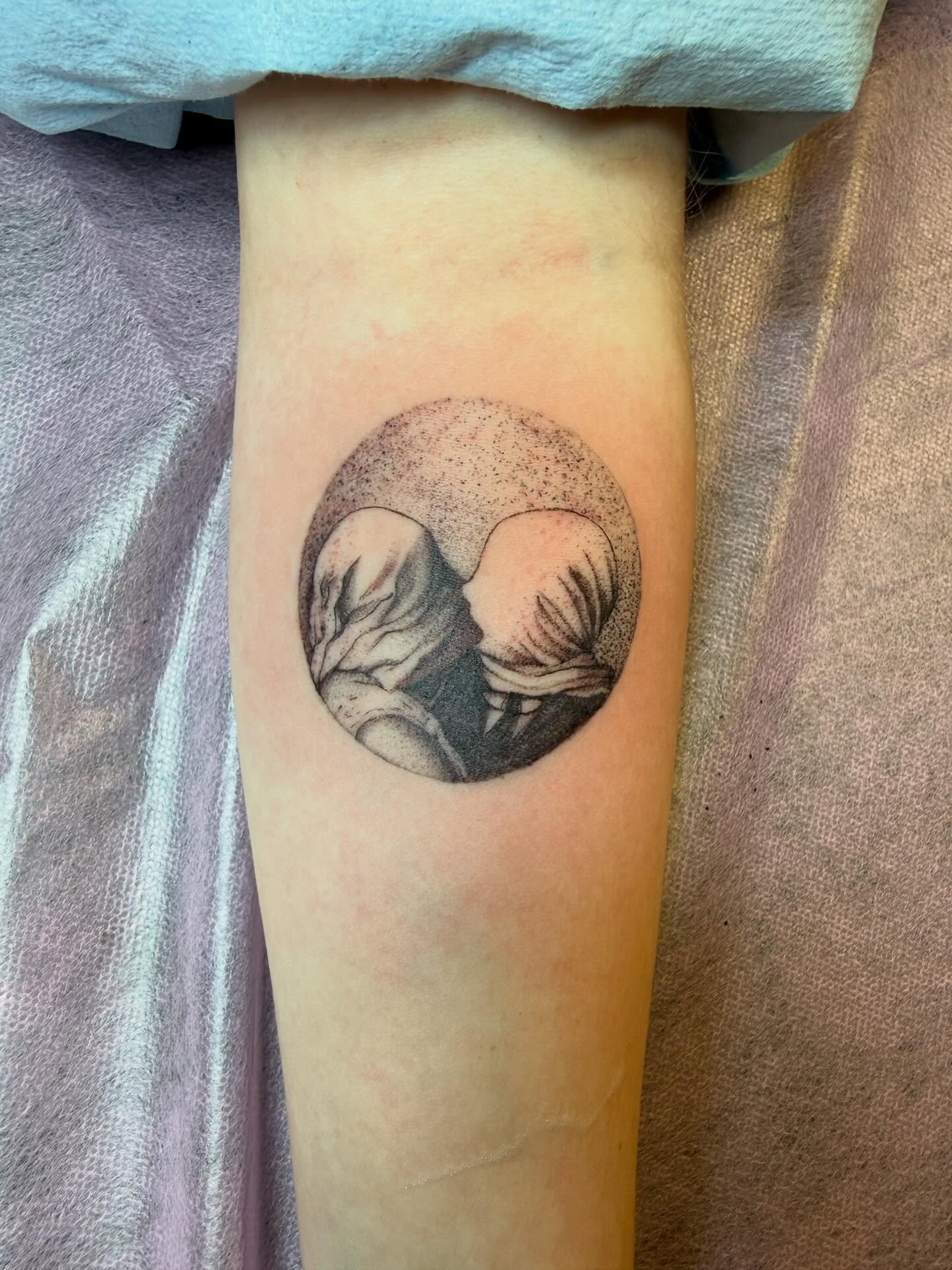 Kissing couple dotwork tattoo on the forearm by Taytum Marsing, Salt Lake City, Utah
