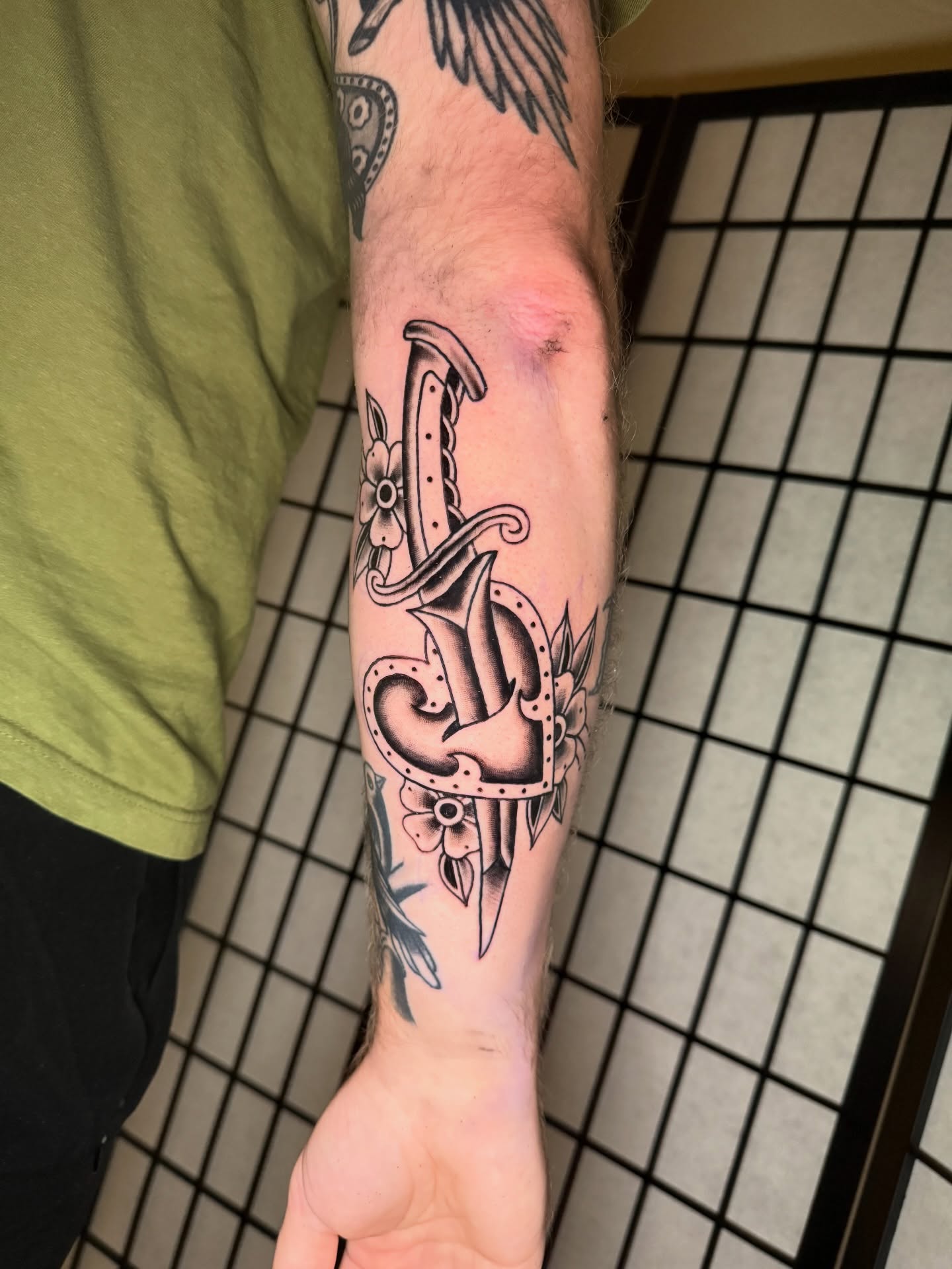Lettering black and grey tattoo on the forearm by Austin Poliszuk, Minneapolis, Minnesota