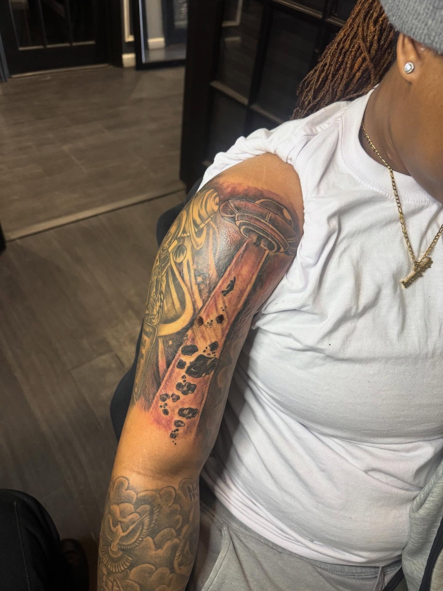 Mechanical arm realism tattoo on the upper arm by Tattoosbydevon