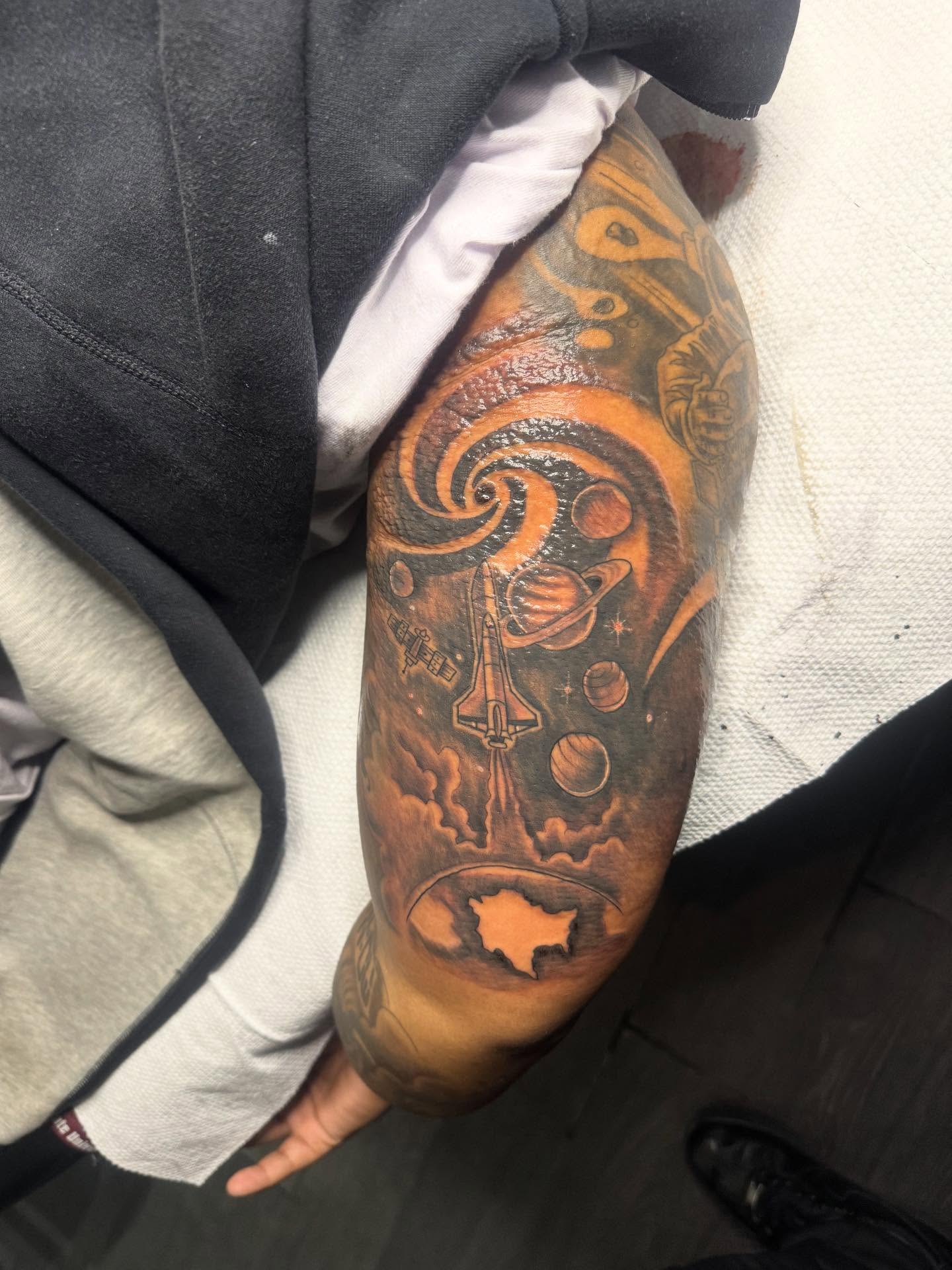 Space shuttle launch realism tattoo on the forearm by Tattoosbydevon