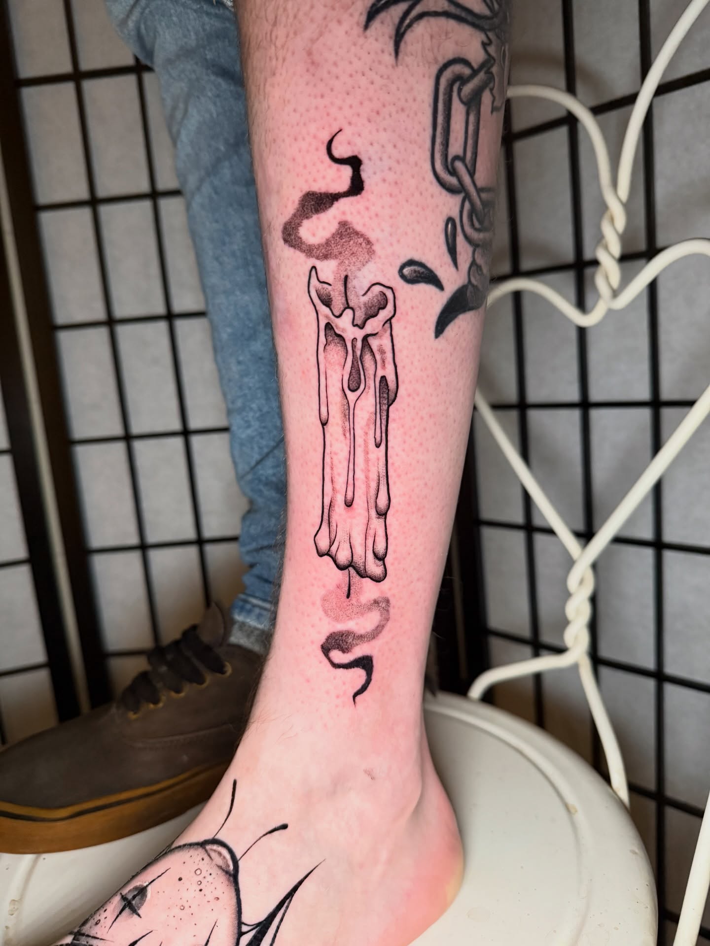 Smoking skull black and grey tattoo on the calf by Austin Poliszuk, Minneapolis, Minnesota