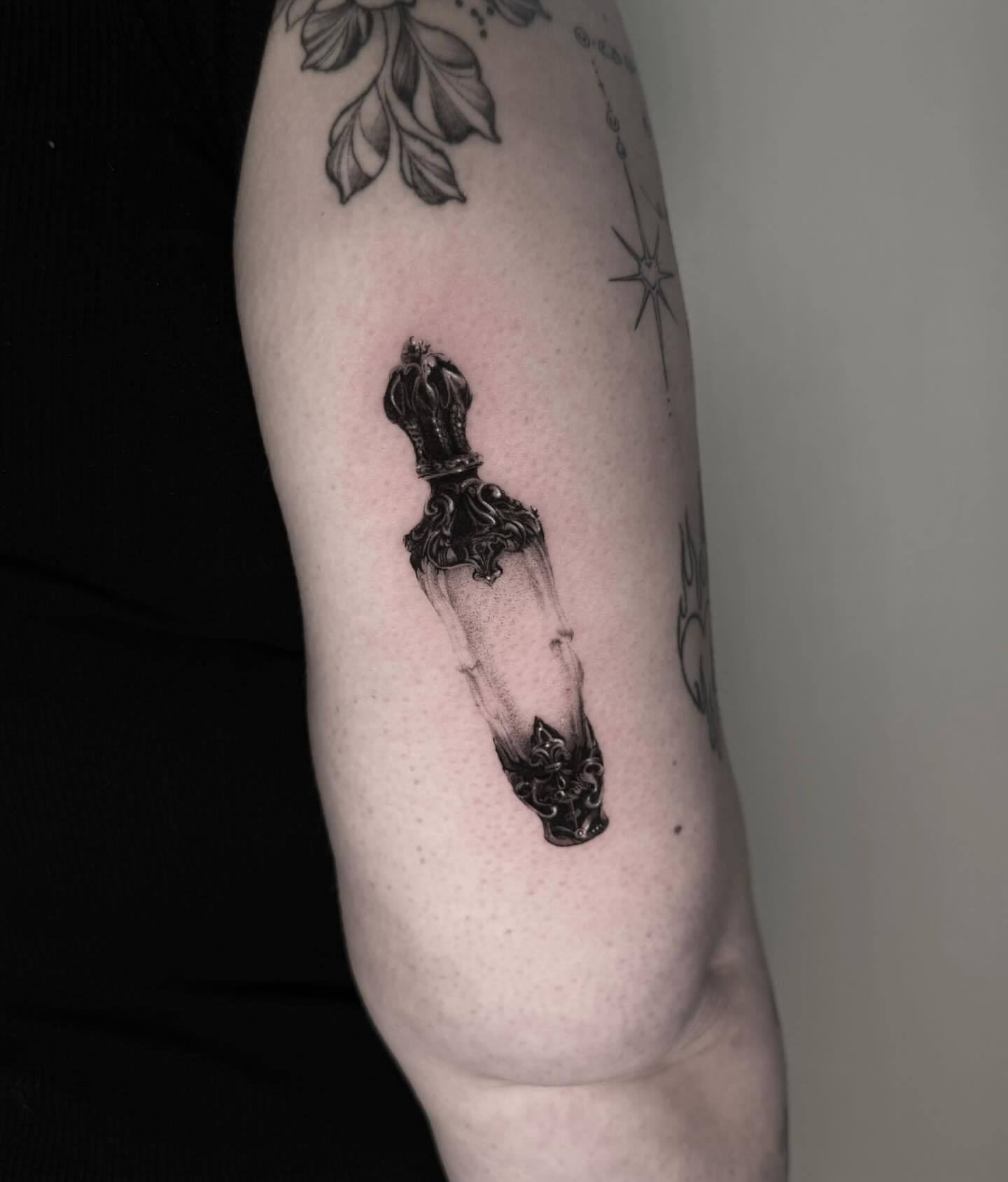 Vial black and grey tattoo on the forearm by ππππππ