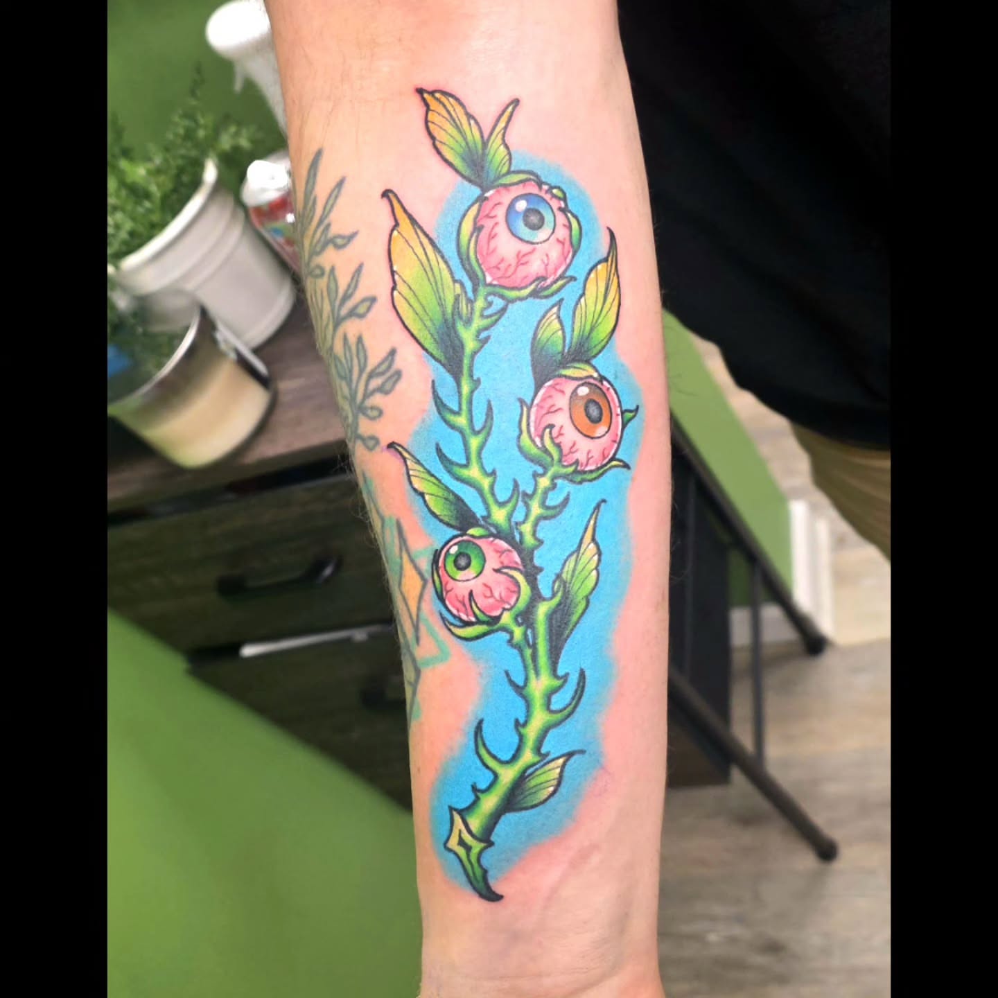 Eye flowers American traditional tattoo on the forearm by 𝓚𝔂𝓻𝓪 𝓥𝓮𝓻𝓻𝔂