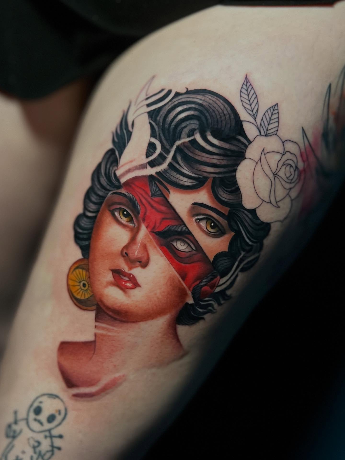 Woman's face realism tattoo on the thigh by Matthew Arguello