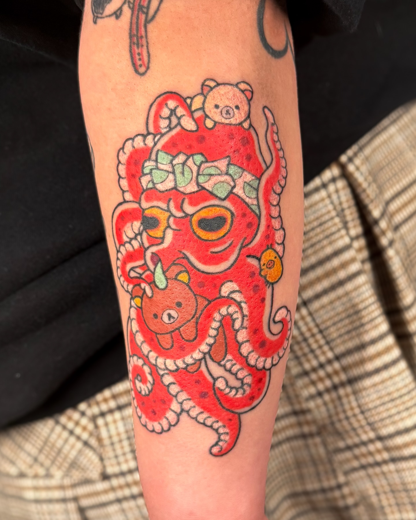 Octopus and teddy bear American traditional tattoo on the forearm by binh