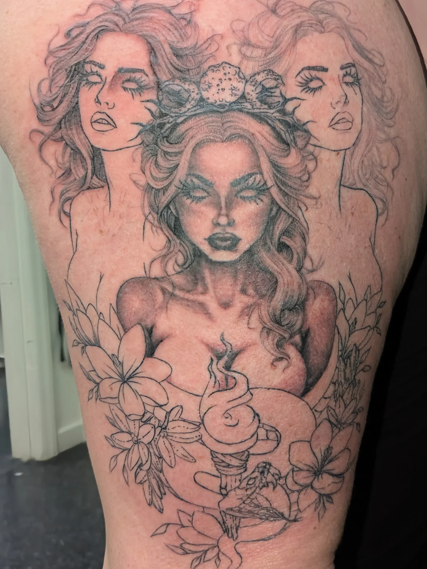 Woman with crown realism tattoo on the thigh by Jessica Thomas Fleischman, Morganton, North Carolina