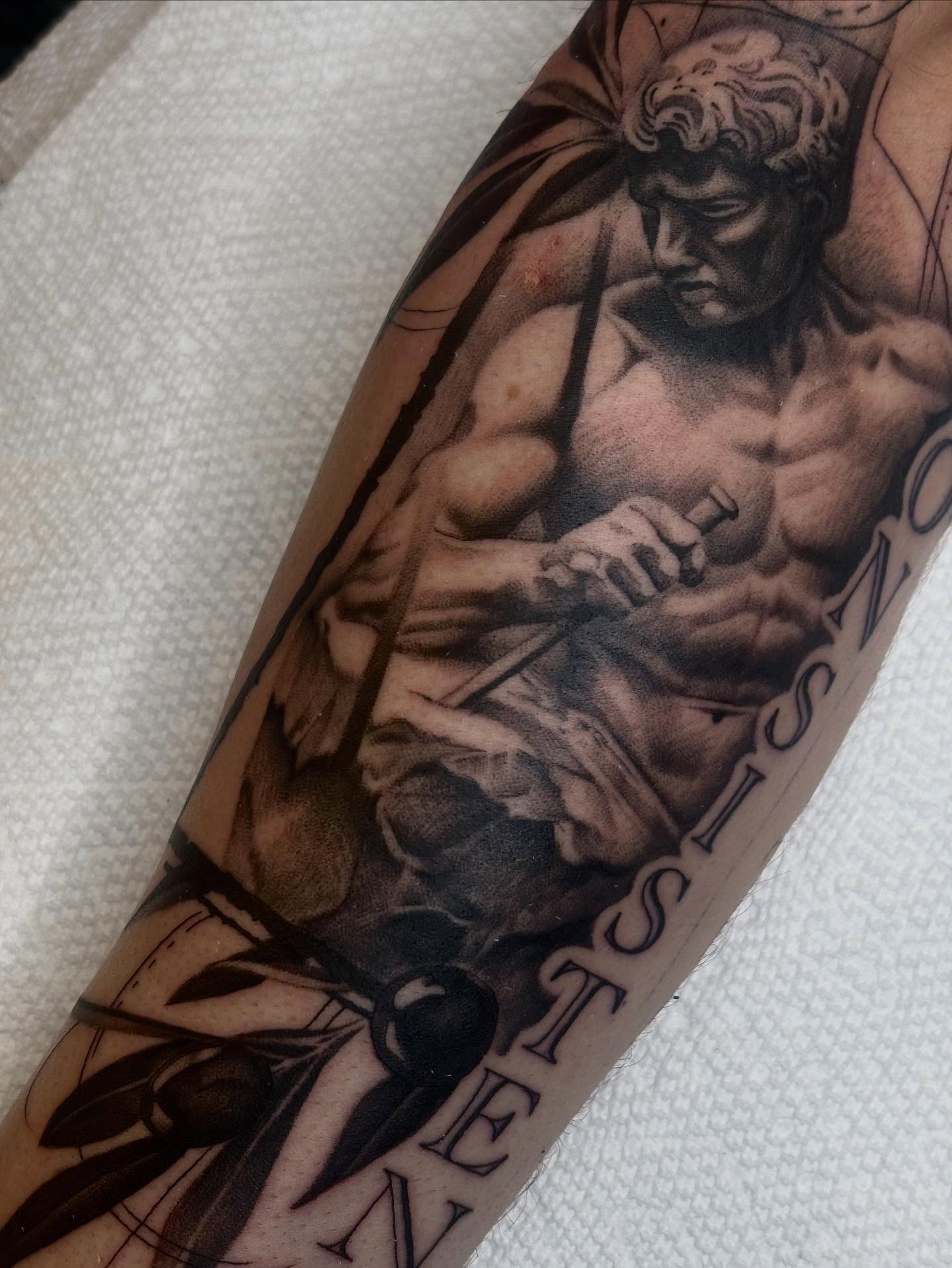 Statue of a muscular man realism tattoo on the forearm by š¤Madeline Kristenš¤, Somerset, Wisconsin