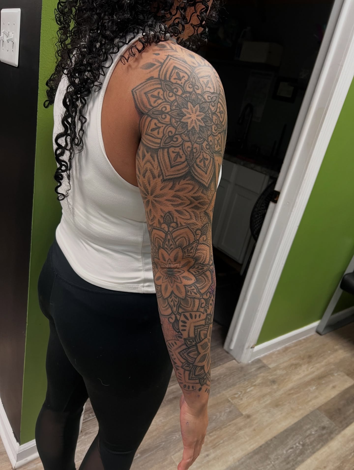 Mandala geometric tattoo on the upper arm by Olivia Suzanne Fada