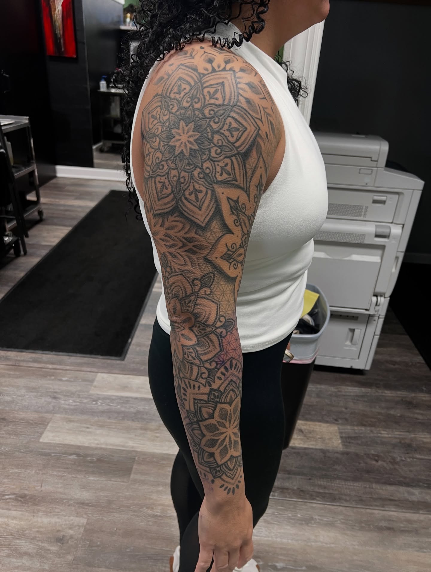Mandala geometric tattoo on the upper arm by Olivia Suzanne Fada