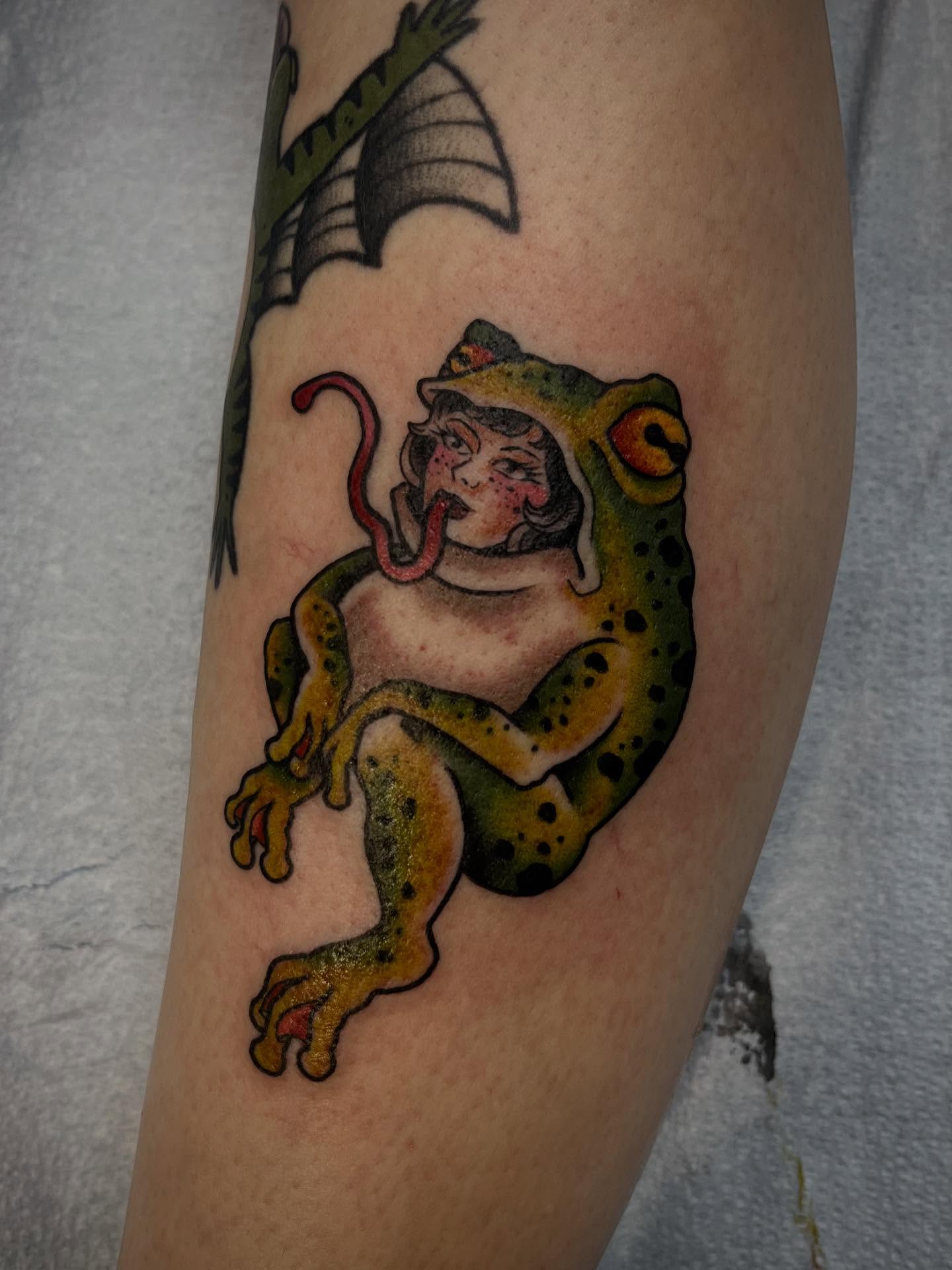 Frog with woman American traditional tattoo on the forearm by Allie Tippets, Gilbert, Arizona